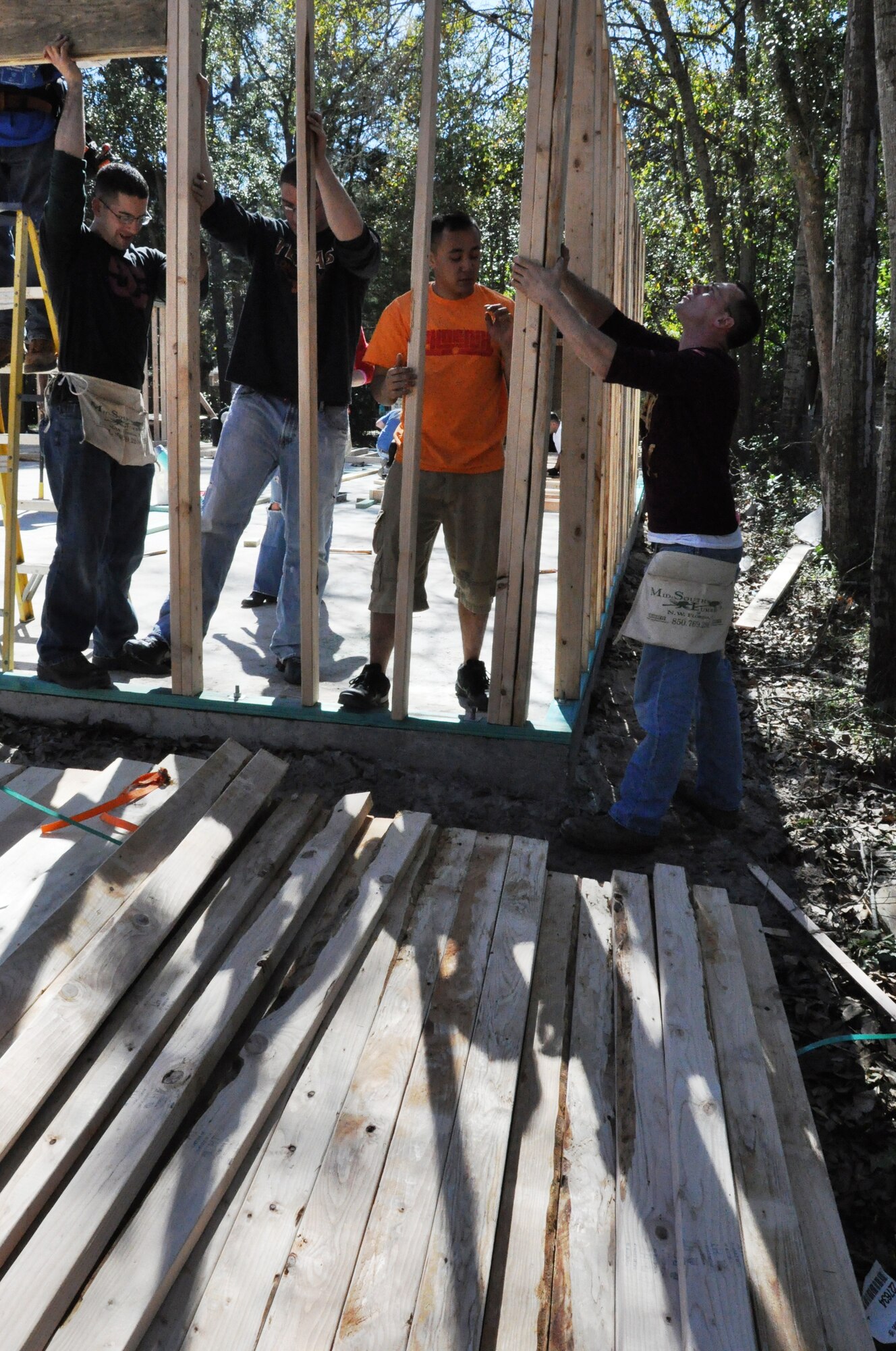 Airmen from the 325th Maintenance Squadron Aerospace Ground Equipment shop, set a wall for a Bay County Habitat for Humanity home Feb. 2. (U.S. Air Force photo by Staff Sgt. Rachelle Elsea)