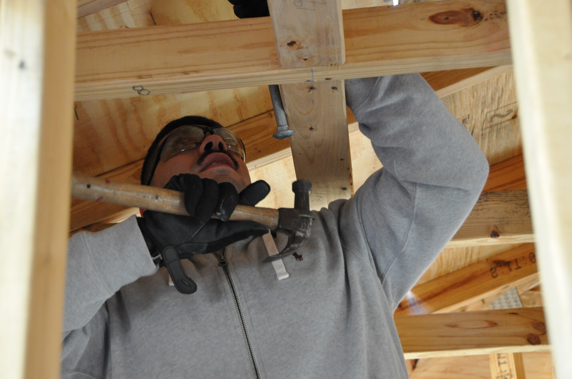 Staff Sgt. Christopher Valladolid, 325th Maintenance Squadron Aerospace Ground Equipment personnel, assists with roofing for a Bay County Habitat for Humanity home Feb. 2. (U.S. Air Force photo by Staff Sgt. Rachelle Elsea)