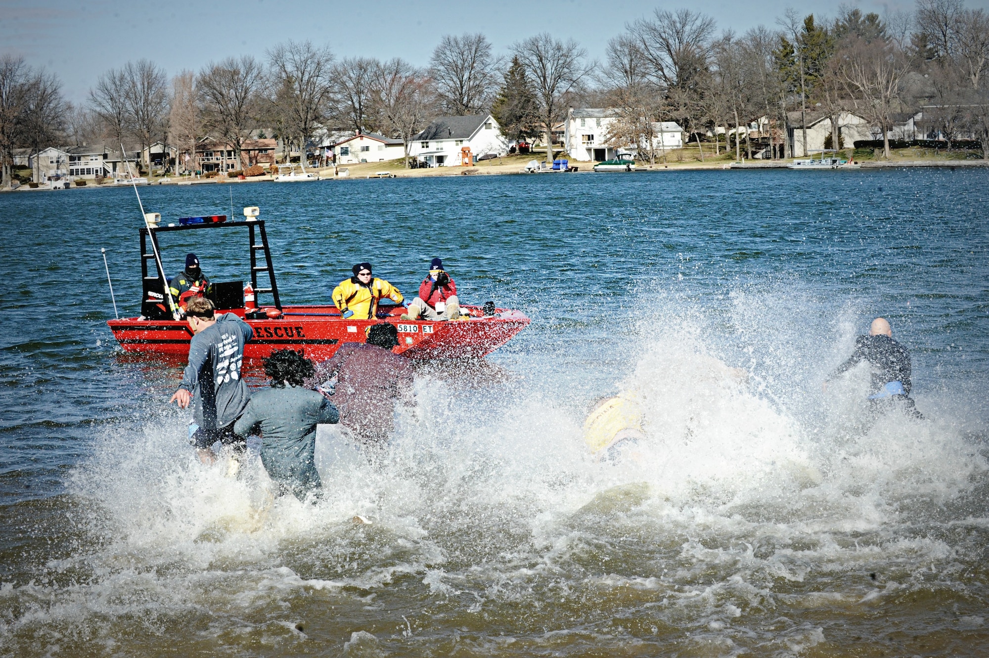 For 10 years, Lake St. Louis has hosted the Polar Plunge and while many said last year’s event was even colder, this year’s temps in the mid 30s still gave participants a shock, which is why local police and rescue squads were on hand to assist.  (U.S. Air Force photo/Karen Petitt)