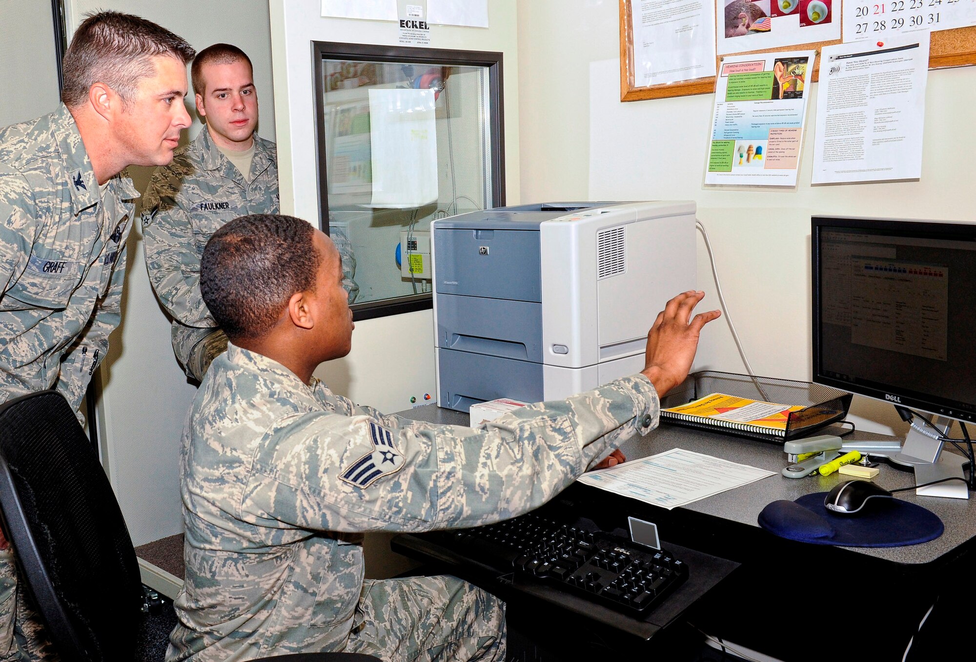 Senior Airman Vermont Graves, 325th Aerospace Medicine Squadron public health technician, showed Colonel David E. Graff, 325th Fighter Wing commander, his duties and role in Tyndall’s mission during the Airman Shadow Program Feb. 1. (U.S. Air Force photo by Christopher Cokeing)