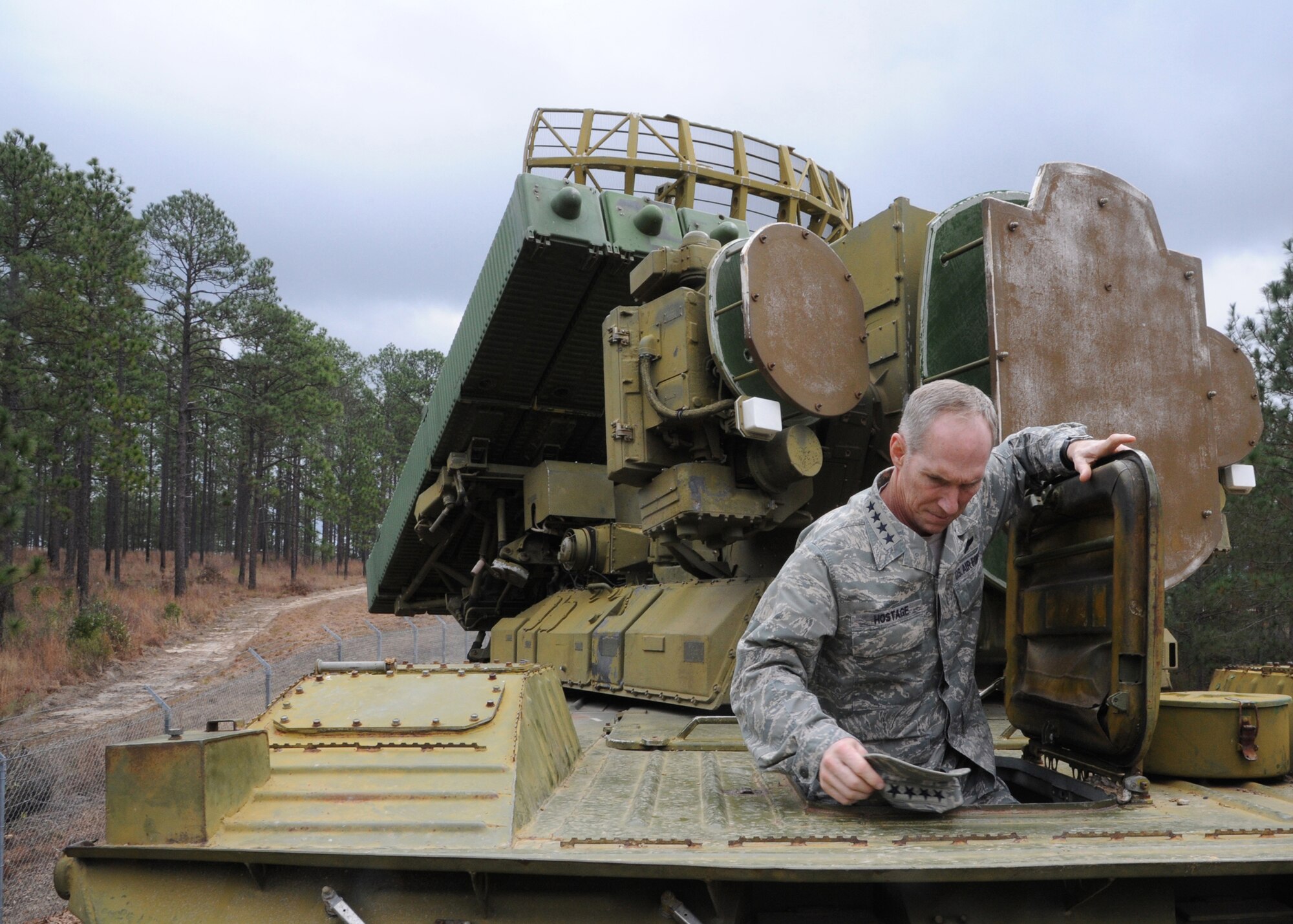 U.S. Air Force Gen. Mike Hostage, commander of Air Combat Command, exits a SA-8 Gecko surface-to-air missile system at Fort Polk, La., Jan. 24. Hostage was briefed on the capabilities and threat representations for a Green Flag exercise. (U.S. Air Force photo/Airman 1st Class Joseph A. Pagán Jr./Released)