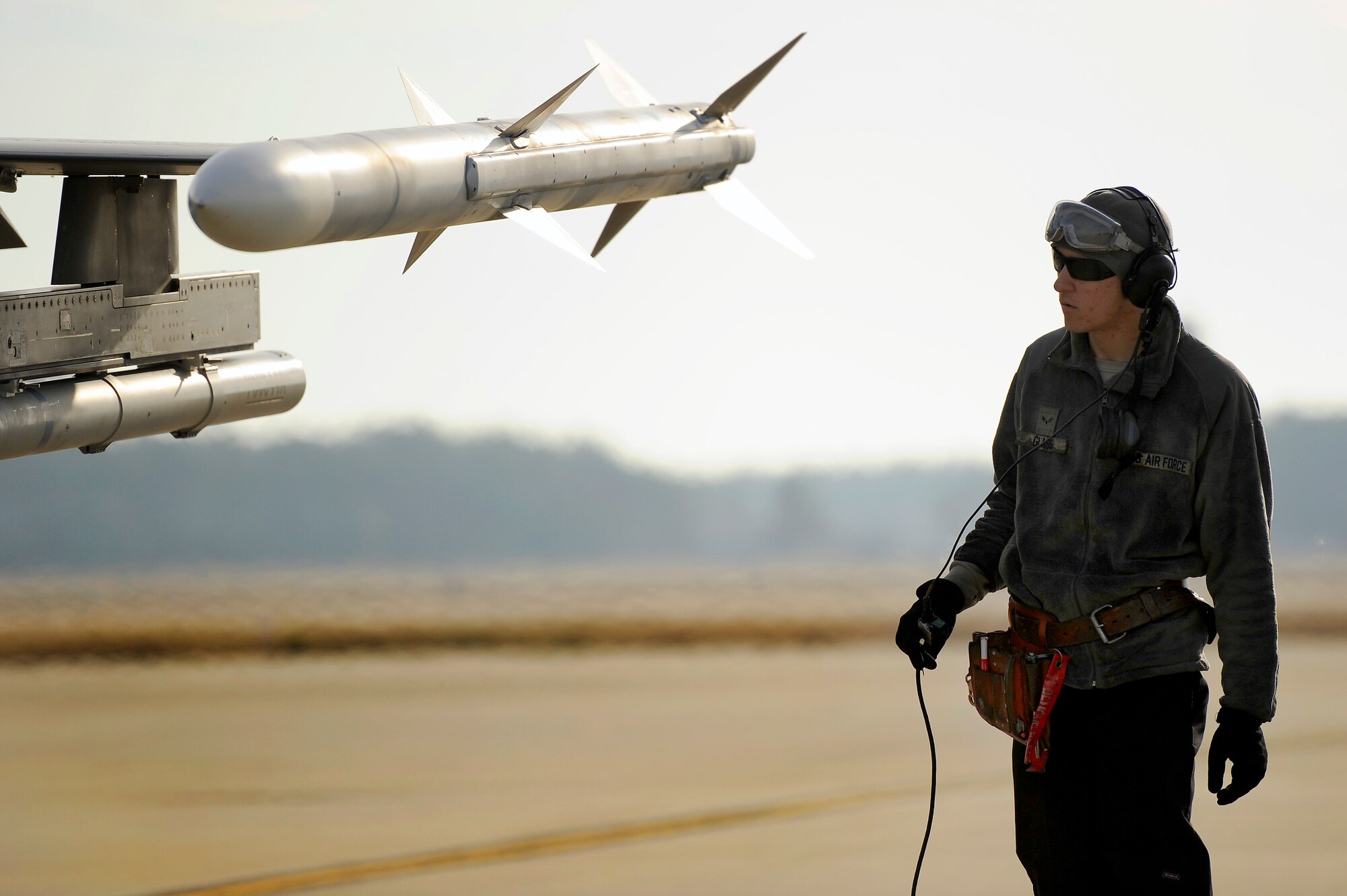 U.S. Air Force Airman 1st Class Justin Glass, 20th Aircraft Maintenance Squadron aircraft maintainer, inspects an F-16 Fighting Falcon during “hot pit” refueling, Jan. 10, 2013, Shaw Air Force Base, S.C. Glass is the Shaw Spotlight for the week of Feb. 4 to Feb. 8. (U.S. Air Force photo by Staff Sgt. Kenny Holston/Released)