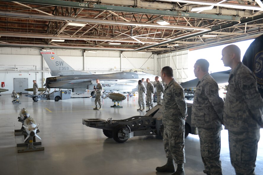The 79th Aircraft Maintenance Unit “Tigers” competed against the 55th AMU “Shooters” at the Weapons Load Crew of the Year competition at Shaw Air Force Base, S.C., Feb. 1, 2013. The 77th AMU “Gamblers” will be competing from their deployed location and will send their scores. The weapon’s load competition is held once a quarter which leads up to the annual competition. The contests include a 20-question test based on the munitions the load crews are certified on, a uniform inspection, an inspection of their 250-piece tool box and their speed and efficiency in loading weapons. The weapons the competitors loaded included two types of air-intercept missiles, two AIM-120 missiles, two AIM-9M missiles and 510 rounds of 20mm ammunition. The results of the annual competition are scheduled to be released at the Maintenance Professional of the Year Banquet, April 26, 2013. (U.S. Air Force photo by Airman 1st Class Krystal M. Jeffers/Released)