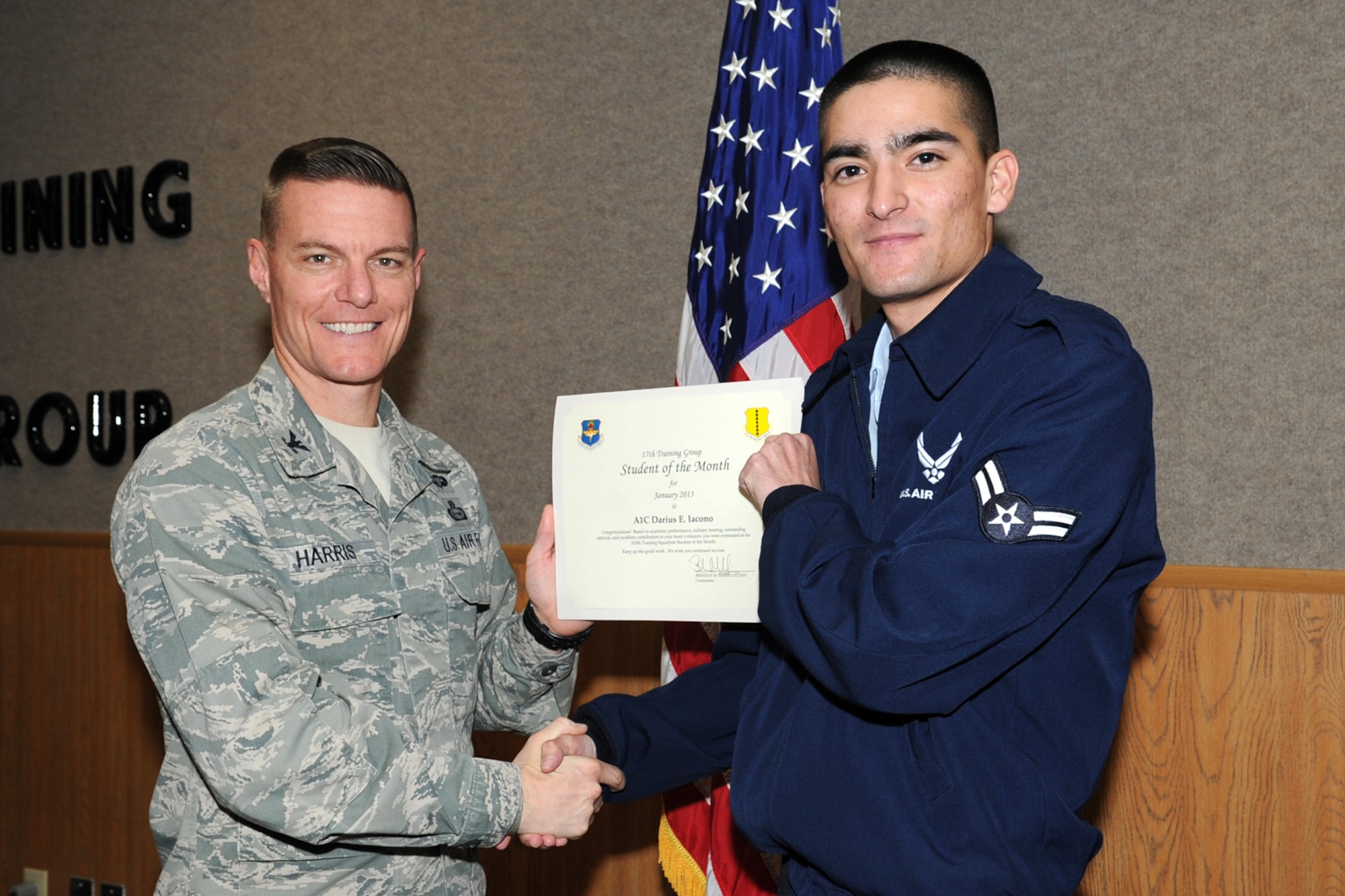 GOODFELLOW AIR FORCE BASE, Texas- Col. Brendan Harris, 17th Training Group Commander, presents Airman 1st Class Darius Lacono with the 315th Training Squadron Enlisted Student of the Month award for January here, Feb. 1. (U.S. Air Force photo/ Staff Sgt. Laura R. McFarlane)