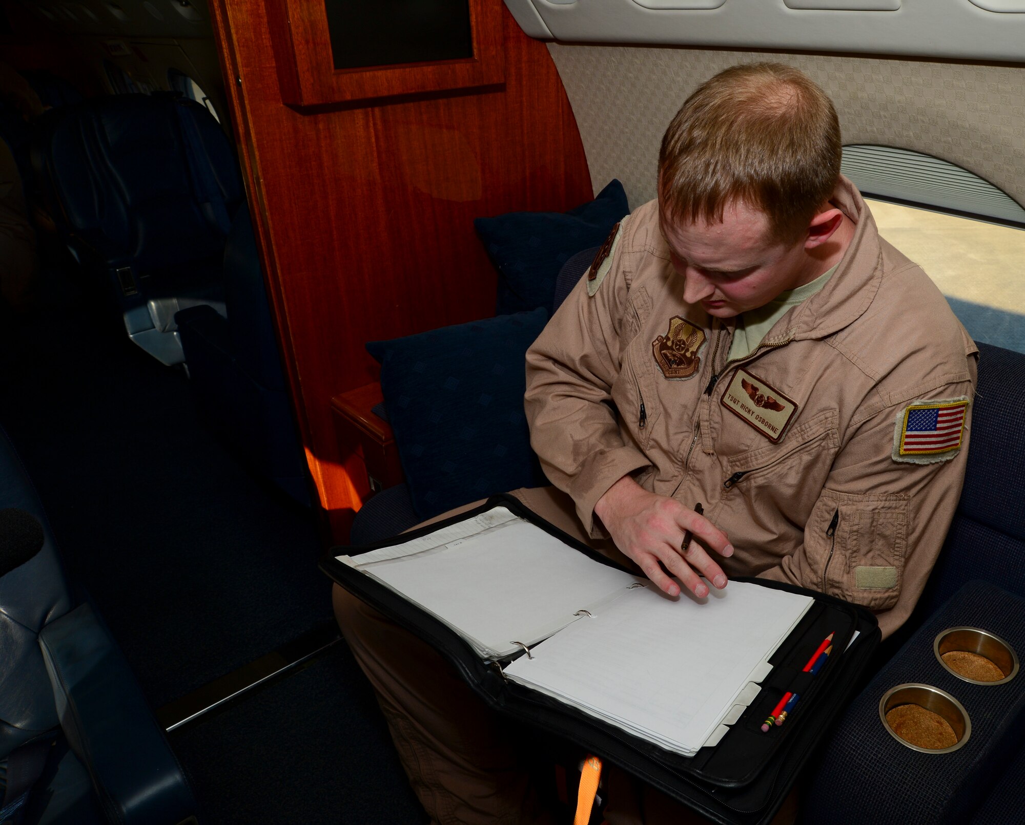 Tech. Sgt. Ricky Osborne, 310th Airlift Squadron flight engineer, preforms a pre-flight check in preparation for a deployment at MacDill Air Force Base, Fla., Jan. 27, 2013. This is the first time the 310th AS has ever deployed. (U.S. Air Force photo by Senior Airman Melissa Paradise/Released)