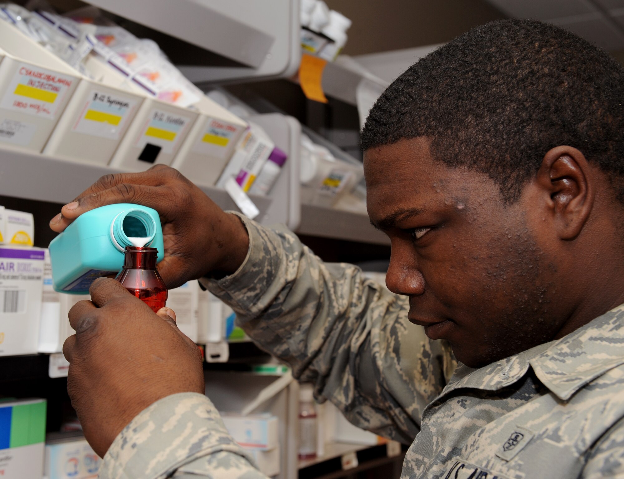 Senior Airman Roger Ruffin, 2nd Medical Support Squadron pharmacy technician, compounds prescription medication at the base pharmacy on Barksdale Air Force Base, La., Feb. 4. The base pharmacy is in charge of handling all medications needed to treat the active duty and reserve population of Barksdale and retirees in the local community. (U.S. Air Force photo/Airman 1st Class Benjamin Gonsier)
