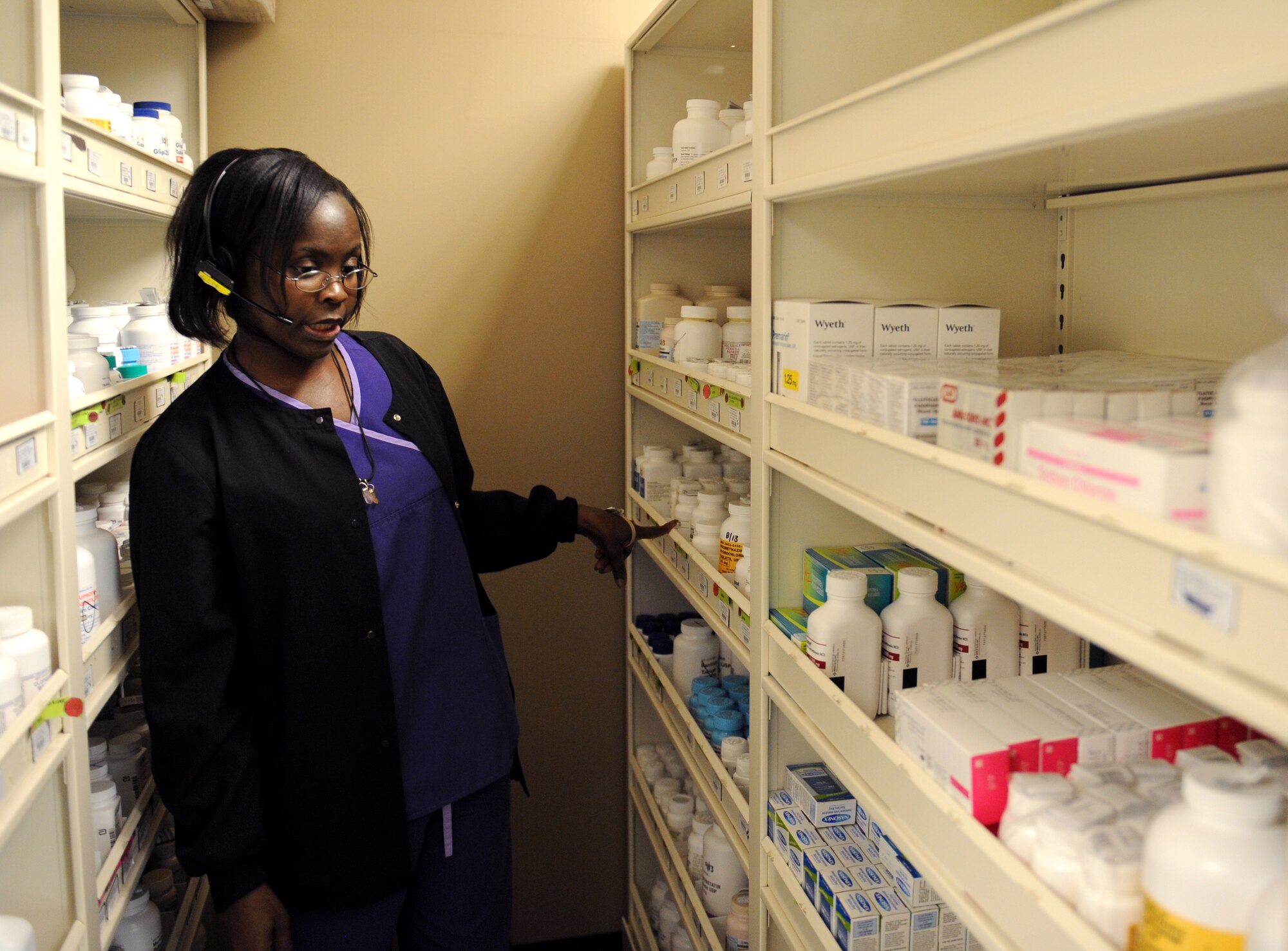 Terri Savage-Campbell, 2nd Medical Support Squadron pharmacy technician, searches for medication at the base pharmacy on Barksdale Air Force Base, La., Feb. 4. The base pharmacy is in charge of handling all medications needed to treat the active duty and reserve population of Barksdale and retirees in the local community. (U.S. Air Force photo/Airman 1st Class Benjamin Gonsier)
