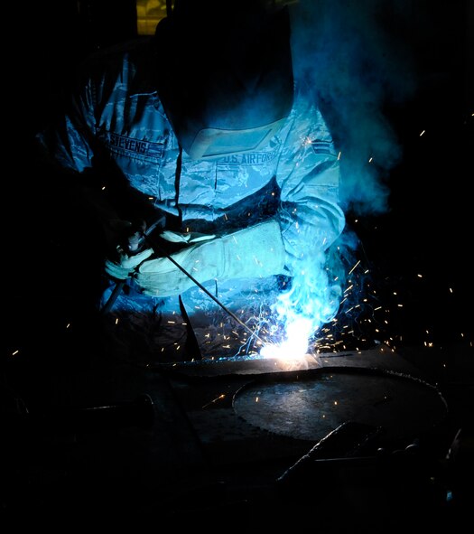 Airman 1st Class Jacob Stevens, 2nd Civil Engineer Squadron structures section, uses an arc welder to weld together two sheets of metal during upgrade training on Barksdale Air Force Base, La., Feb. 4. The structures shop's responsibilities include roof repairs, replacing doors and glass, metal working, masonry and carpentry. (U.S. Air Force photo/Airman 1st Class Andrew Moua)