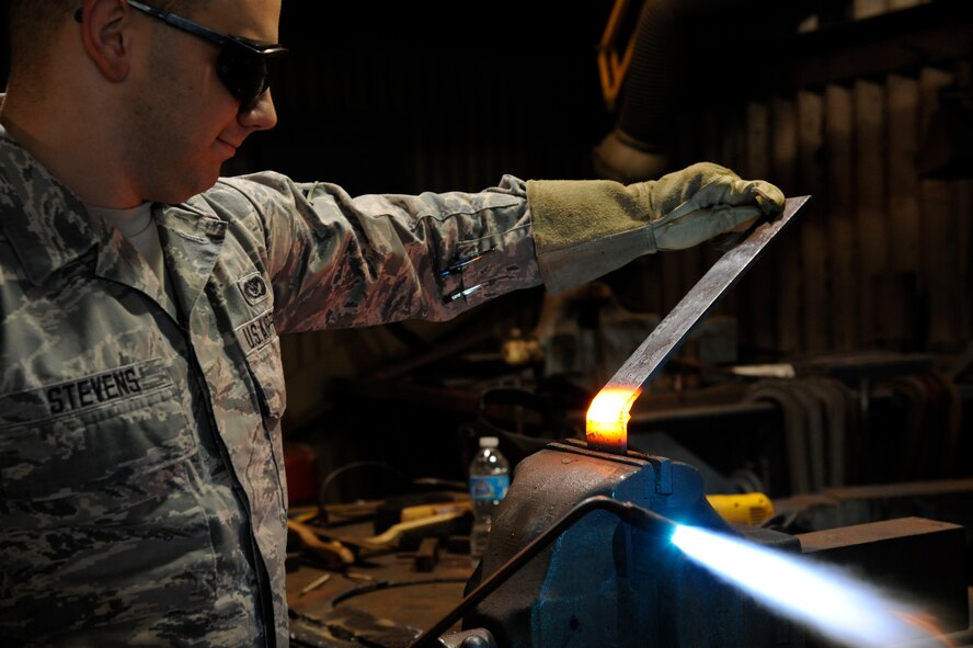 Airman 1st Class Jacob Stevens, 2nd Civil Engineer Squadron structures section, bends a piece of metal during training on Barksdale Air Force Base, La., Feb. 4. The structures shop's responsibilities include roof repairs, replacing doors and glass, metal working, masonry and carpentry. (U.S. Air Force photo/Airman 1st Class Andrew Moua)