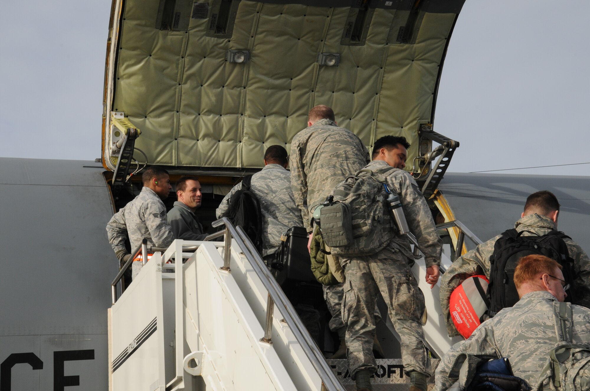 Airmen from the 100th Air Refueling Wing board a KC-135R Stratotanker ready to deploy in support of operations in Mali Jan. 26, 2013, at RAF Mildenhall, England. The 100th ARW will provide a much-needed air-to-air refueling capability to forces operating in Northern Africa. Approximately 130 Airmen deployed out of RAF Mildenhall after receiving their deployment order to support French operations in Mali. (U.S. Air Force photo by 1st Lt. Christopher Mesnard/Released)