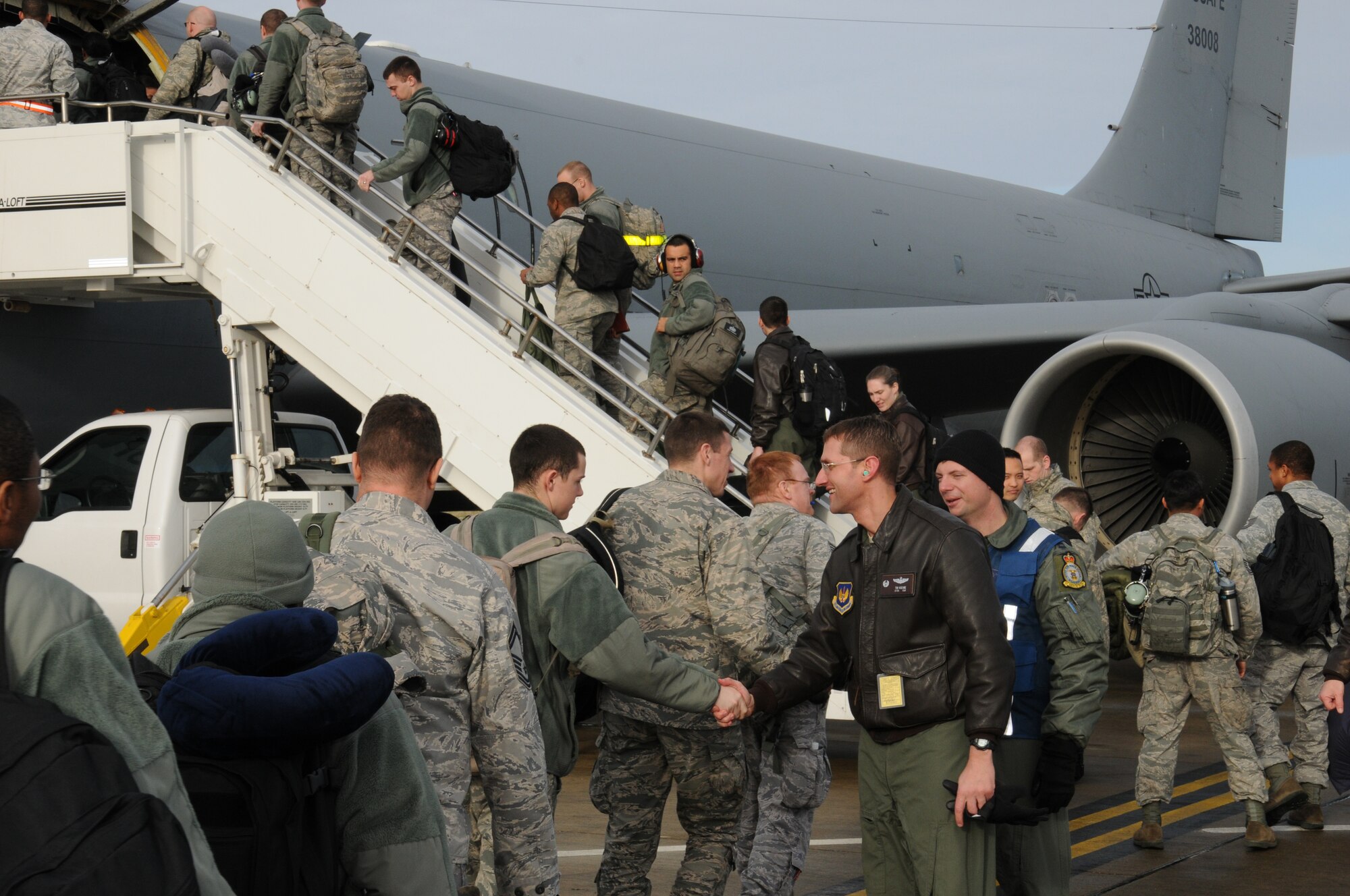 Airmen from the 100th Air Refueling Wing board a KC-135R Stratotanker ready to deploy in support of operations in Mali Jan. 26, 2013, at RAF Mildenhall, England. The 100th ARW will provide a much-needed air-to-air refueling capability to forces operating in Northern Africa. Approximately 130 Airmen deployed out of RAF Mildenhall after receiving their deployment order to support French operations in Mali. (U.S. Air Force photo by 1st Lt. Christopher Mesnard/Released)