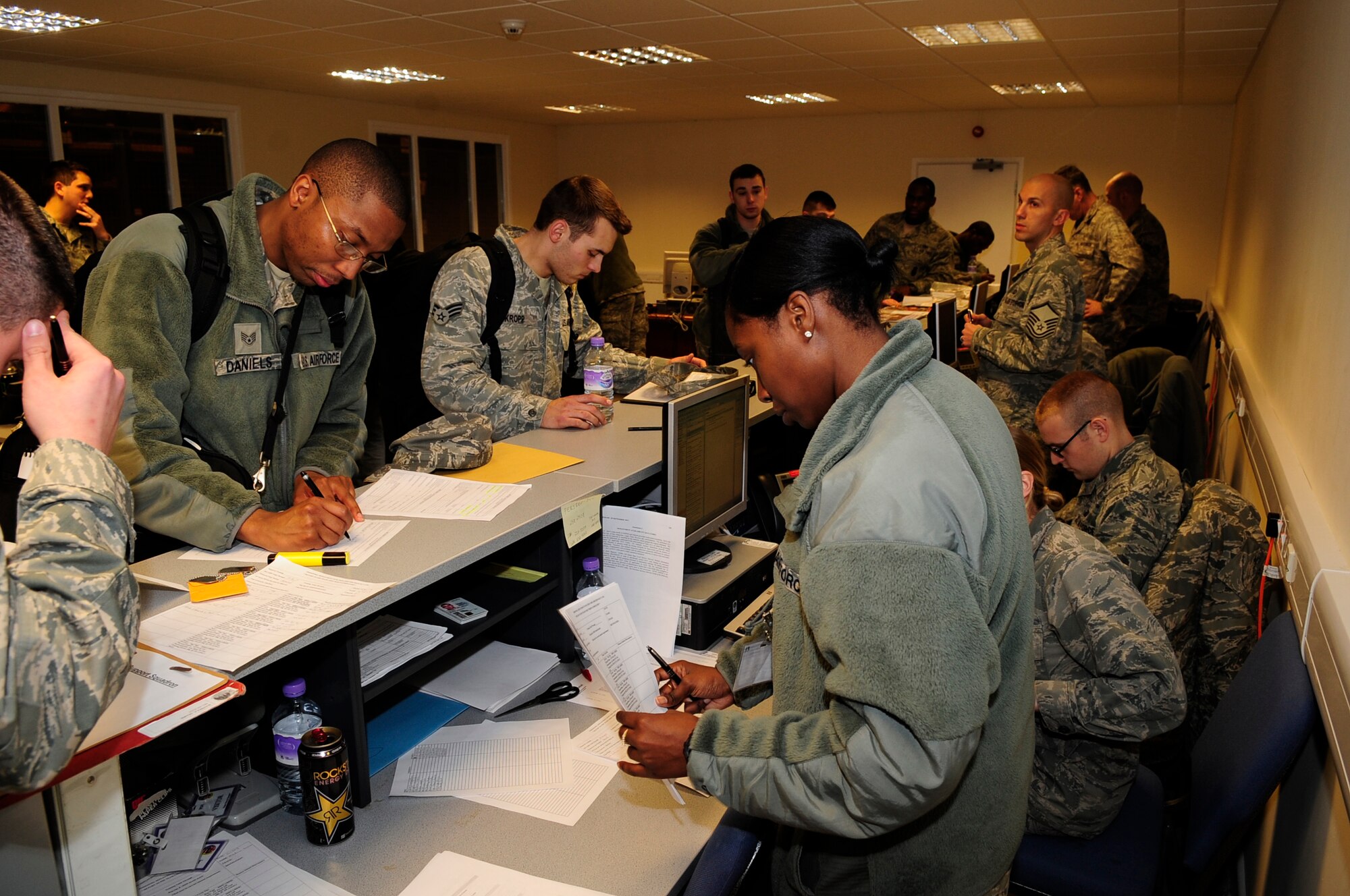 Airmen from the 100th Air Refueling Wing process through a pre-deployment line Jan. 14, 2013, at RAF Mildenhall, England. The 100th ARW will provide a much-needed air-to-air refueling capability to forces operating in Northern Africa. (U.S. Air Force photo by Airman 1st Class Dillon Johnston/Released)