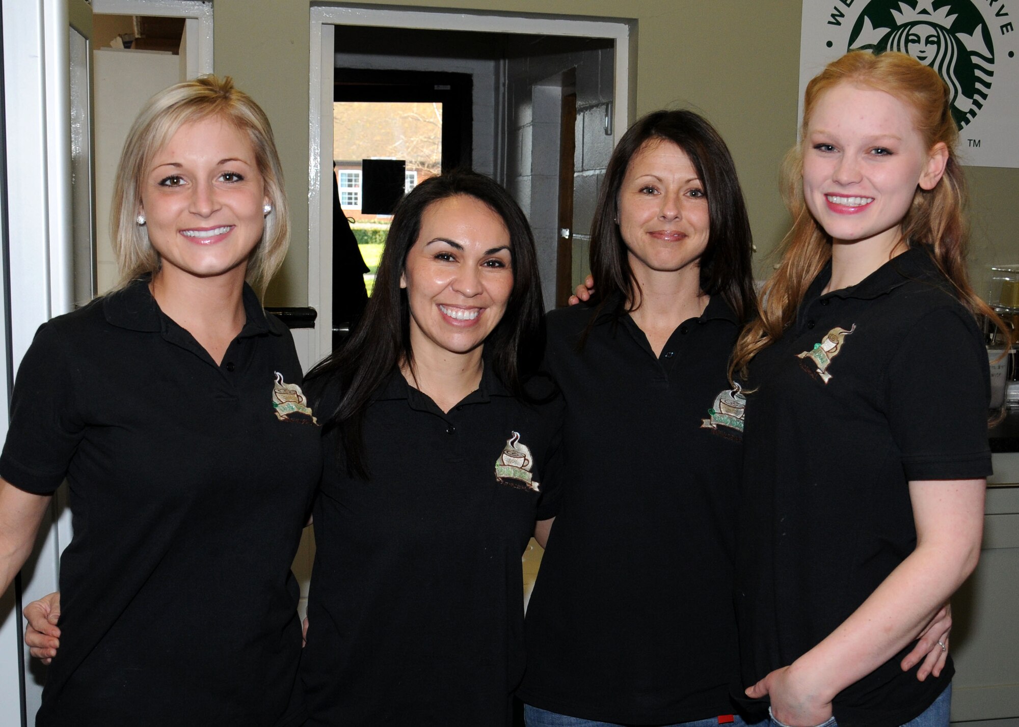 Members of staff from the Daily Grind coffee shop in the Bob Hope Community Center ready to serve Team Mildenhall’s coffee needs Feb. 4, 2013, at RAF Mildenhall, England. This was the Daily Grind’s first renovation in seven years. During the renovation period coffee was served at the Galaxy Club on RAF Mildenhall. (U.S. Air Force photo by Gina Randall/Released)