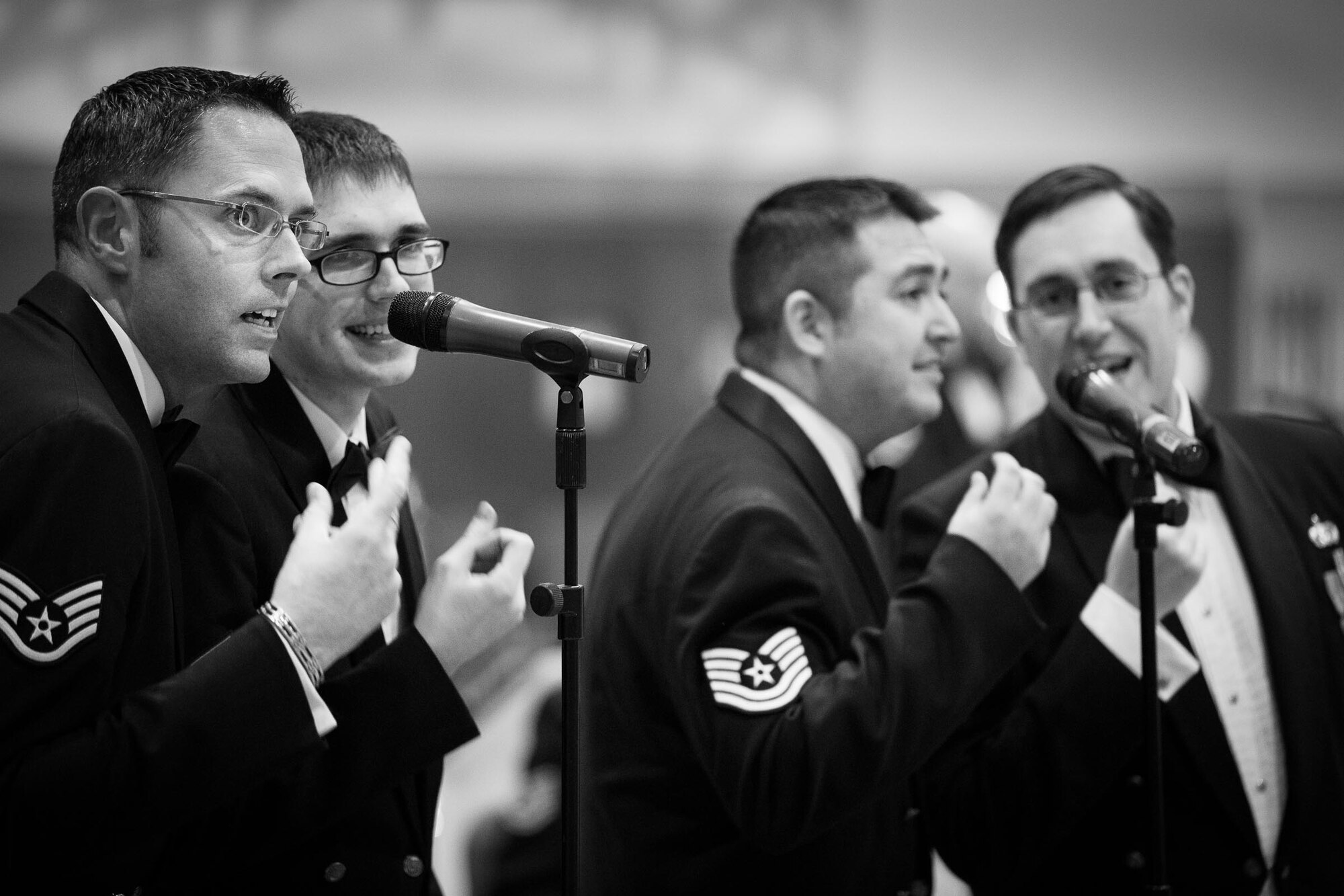 YOKOTA AIR BASE, Japan -- Band of the Pacific-Asia musicians snap their fingers while singing "Hit That Jive, Jack" at Yokota Middle School, Yokota Air Base, Japan, Jan. 30, 2013. (U.S. Air Force photo by Staff Sgt. Josh Voyles)