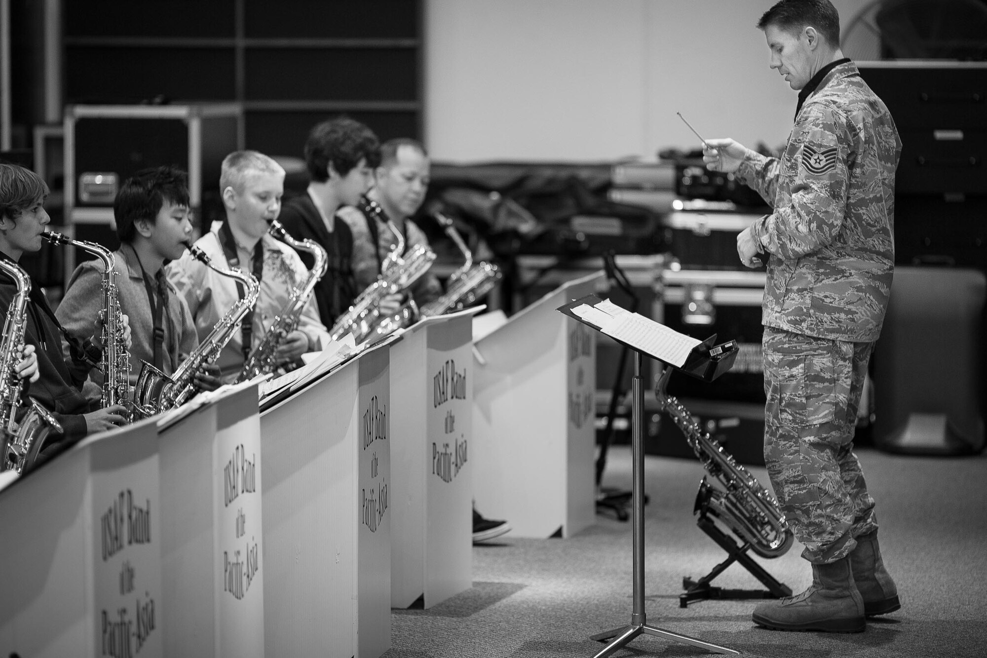 YOKOTA AIR BASE, Japan -- Yokota Middle School students prepare for a joint performance with Pacific Showcase, Band of the Pacific-Asia jazz ensemble, at the Band of the Pacific-Asia rehearsal room, Yokota Air Base, Japan, Jan. 30, 2013. Tech. Sgt. Dwight Wiest, Pacific Showcase NCO in-charge, rehearsed the students in preparation for the evening concert. (U.S. Air Force photo by Staff Sgt. Josh Voyles)