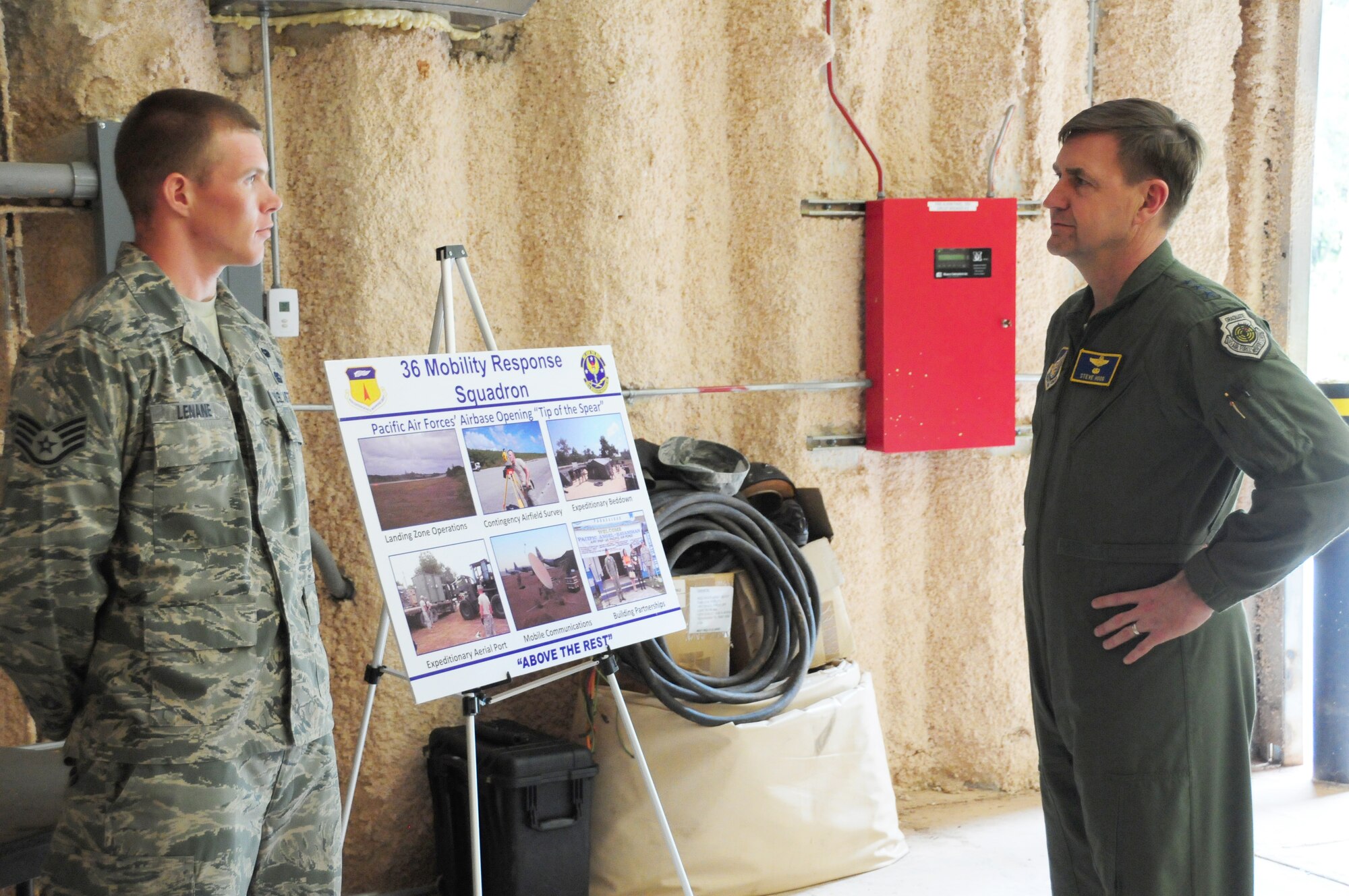 Staff Sgt. Chris Lenane, 36th Mobility Response Squadron, briefs Lt. Gen. Stephen Hoog, U.S. Air Force Alaskan Command and 11th Air Force commander, on the 36th MRS role and responsibilities in the Pacific Region at Northwest Field, Guam, Feb. 1. During his trip here, General Hoog visited with the 736th Security Forces Squadron, 36th Mobility Response Squadron, 36th Medical Group and several other squadrons from Andersen, and got a first-hand look at what Andersen Airmen bring to the fight within U.S. Pacific Command area of responsibility. (US Air Force photo by Senior Airman Robert Hicks/Released)