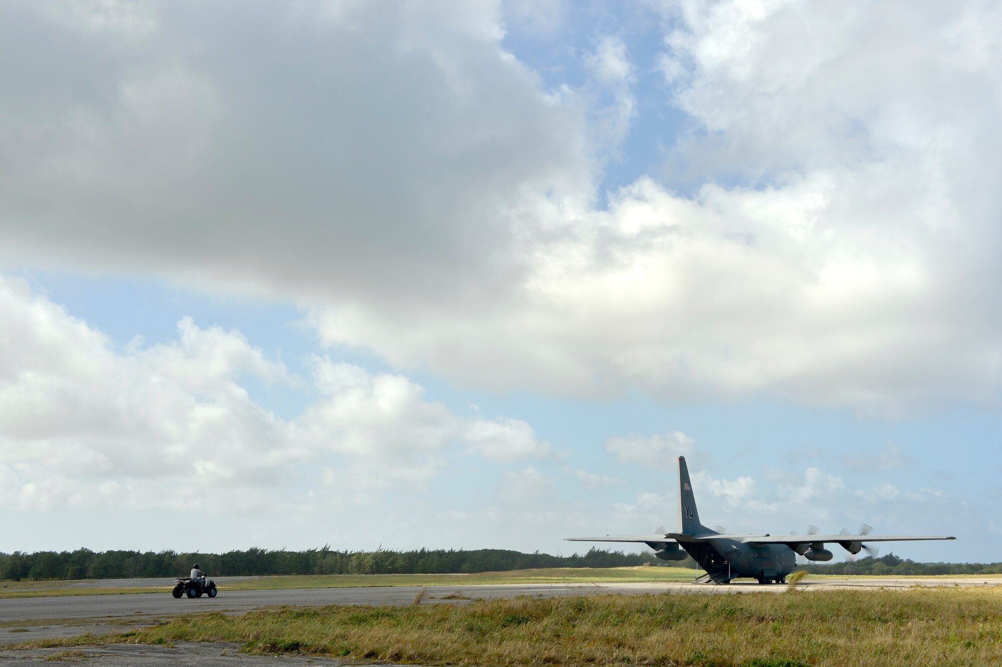 A U.S. Air Force C-130H taxis to the runway and prepares to receive a rolling stock load while participating in Cope North 13 on Northwest Field, Guam, Feb. 5, 2013. Cope North is a multilateral Pacific Air Forces-sponsored Field Training Exercise (FTX) conducted annually at Andersen Air Force Base, Guam. The exercise focuses on humanitarian assistance and disaster relief training, air combat tactics and large force employment in an effort to enhance interoperability among U.S., Japan and Australian forces. (U.S. Air Force photo by Senior Airman Matthew Bruch/RELEASED)