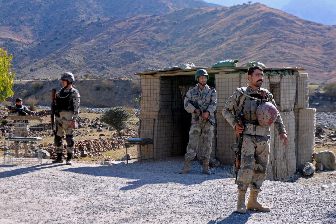 Afghan border police provide security at their observation point in Kunar province, Afghanistan, Jan. 28, 2013.