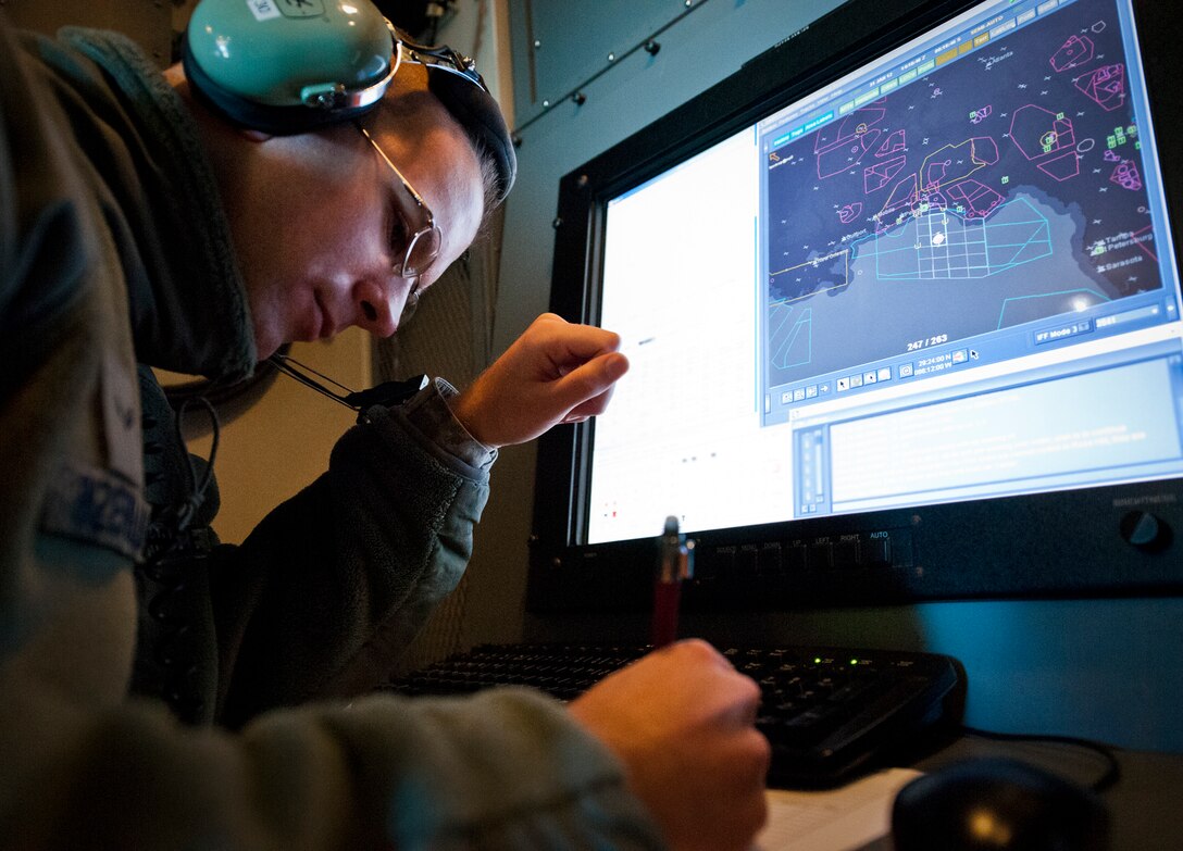 Airman 1st Class Cary Inzerello, a surveillance technician with the 728th Air Control Squadron, takes notes in front of his scope prior to the squadron’s final mission Jan. 31 at Eglin Air Force Base, Fla.  The 62-year-old squadron, an air command and control unit, will be deactivated in May.  Their final mission was to control 33rd Fighter Wing F-35s for a tactical intercept mission.  (U.S. Air Force photo/Samuel King Jr.)