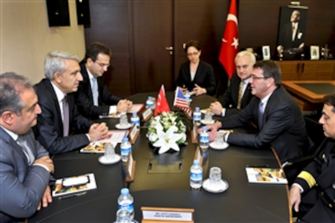 U.S. Deputy Defense Secretary Ashton B. Carter, right center, meets with Undersecretary of Defense for Industries Murad Bayar, left center, at the Ministry of National Defense in Ankara, Turkey, Feb. 4, 2013.