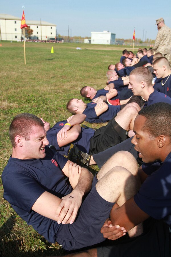 A group of poolees do crunches during an initial strength test conducted at Recruiting Station Charleston’s Statewide Pool Meet, Oct. 13. 