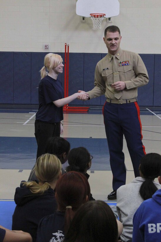 Maj. Matthew Hager, Recruiting Station 
Detroit's commanding officer, welcomes pool members during a female pool 
function here, Jan. 12, to build camaraderie and spread knowledge about the 
Marine Corps. 
