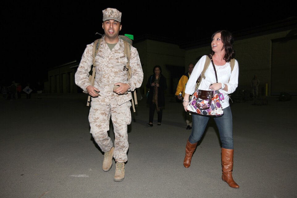 Maj. Tom Chhabra, from Silver Lake, Kan., and a development officer with I Marine Expeditionary Force (Forward), walks to his car with his wife, Janelle, after his homecoming at Camp Pendleton, Calif., Feb. 6. The Chhabra’s were married shortly before Tom deployed to Afghanistan and haven’t seen each other for one year. The homecoming marks the first wave for I MEF (FWD) to return from Afghanistan. The entire unit is scheduled to return by mid-March.