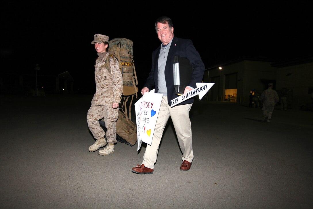 Navy Lt. Kathryn Phillips, from Lambertville, N.J., and a Navy nurse with I Marine Expeditionary Force (Forward), leaves with her dad, Russ Phillips, following her homecoming at Camp Pendleton, Feb. 6. While Phillips was away on deployment, her father, Russ, rode his bike 6,731 miles, which is the exact distance from Lambertville to Lashkar Gah, in Helmand province, Afghanistan, where she spent her deployment. The homecoming marks the first wave for I MEF (FWD). The entire unit is scheduled to return by mid-March.


