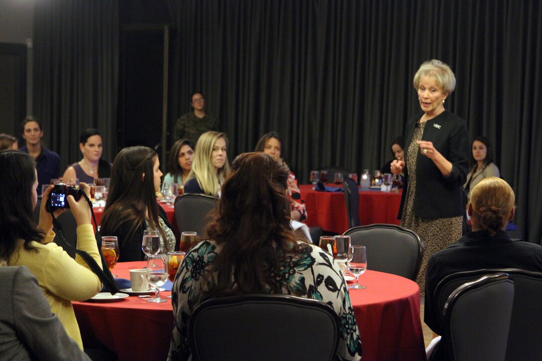 Bonnie Amos, wife of the Commandant of the Marine Corps, responds to a question from Rachel Cannela, audience member and native of Fort Worth, Texas, at the Officers Club aboard Marine Corps Air Station Miramar, Jan. 31. Amos presented an after-action review of her visit to Afghanistan to spouses of servicemembers stationed aboard MCAS Miramar.



