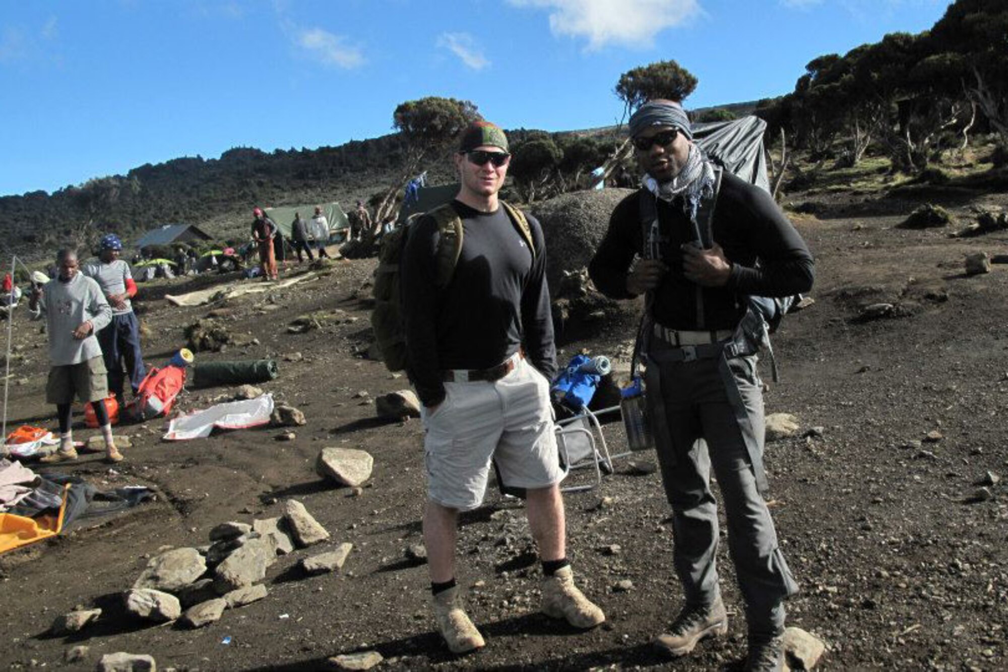 Army 1st Lt. David Horn (left) and Army 1st Lt. Napoleon Dunn, both with the 1st Battalion, 501st Infantry Regiment (Airborne), 4th Brigade Combat Team (Airborne), 25th Infantry Division, pause for a photo in December 2012, at a campsite on Mount Kilimanjaro in Tanzania. It took the pair five days to reach the summit, which is the highest point in Africa. (Courtesy photo)
