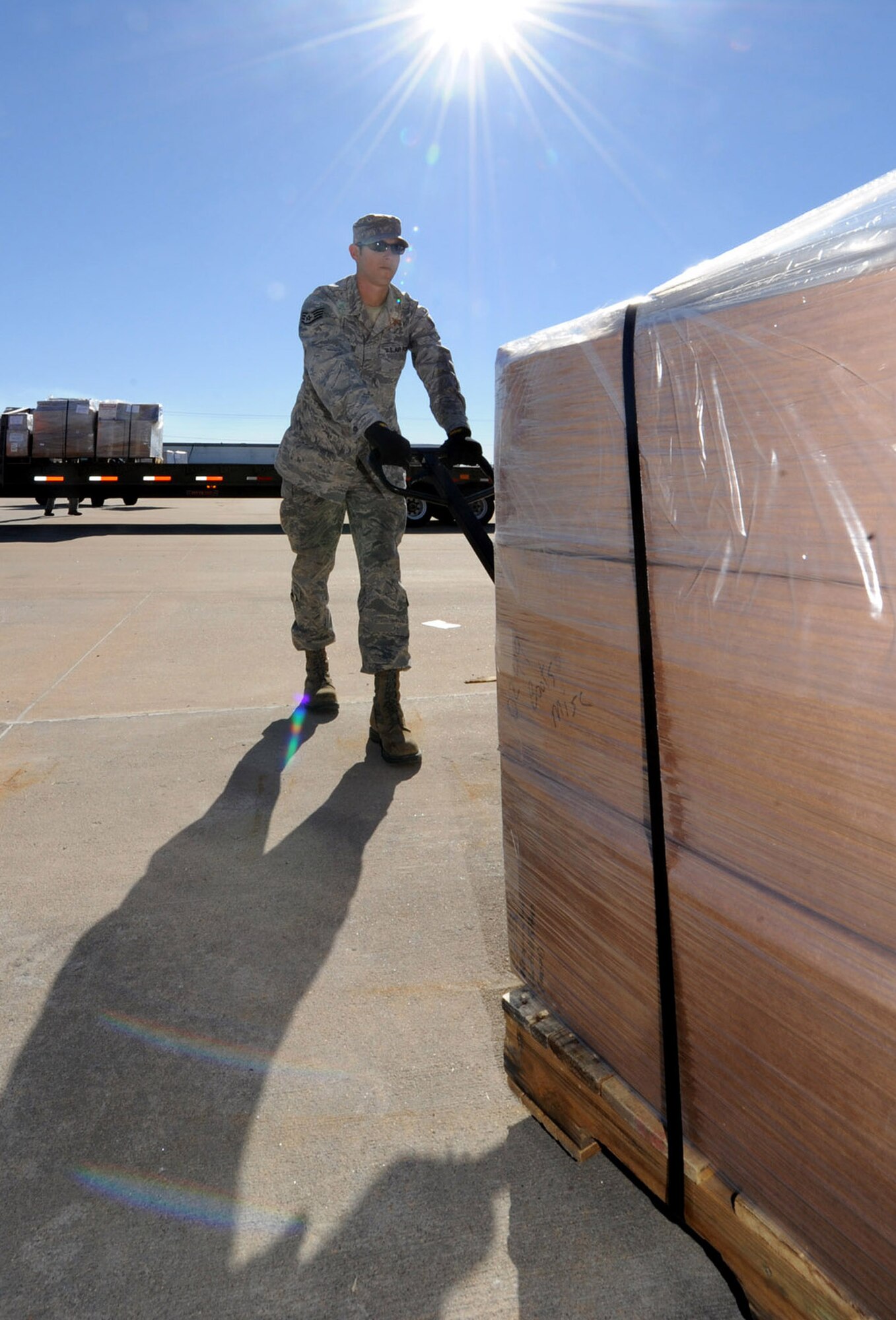 Staff Sgt. Kevin McIntyre, 22nd Logistics Readiness Squadron air cargo operations NCO in charge, positions a pallet of firefighting equipment Feb. 5, 2013, Wichita, Kan. The equipment was being transported from the Wichita Fire Training facility to McConnell Air Force Base, Kan., for processing and future humanitarian airlift to Paraguay. (U.S. Air Force photo/Senior Airman Laura L. Valentine)