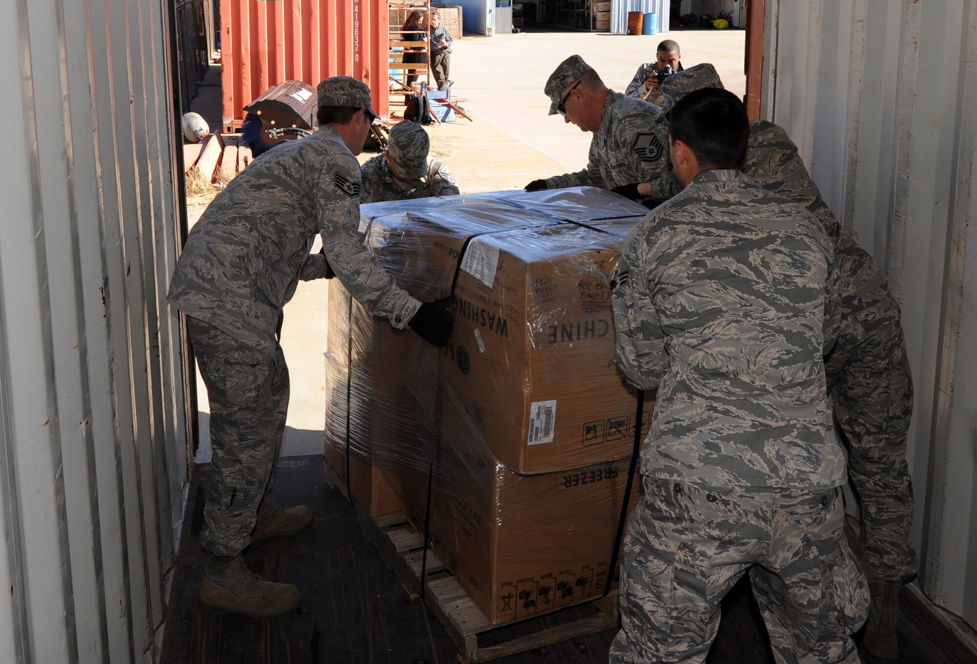 Airmen from the 22nd Logistics Readiness Squadron ready a pallet of firefighting equipment to be loaded for transport to McConnell Air Force Base, Kan., Feb. 5, 2013, Wichita, Kan. Five-tons of equipment were moved from the Wichita Fire Department Training Center to McConnell AFB for airlift to Paraguay in support of the international partnership organization Kansas-Paraguay Partners. (U.S. Air Force photo/Senior Airman Laura L. Valentine)