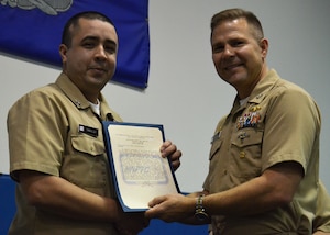 Capt. Jon “Jay” Fahs congratulates Petty Officer 1st Class Timothy Traylor, one of four Naval Nuclear Power Training Command’s Sailors of the Quarter, for the last quarter of calendar year 2012 Jan. 31, 2013, at NNPTC at Joint Base Charleston – Weapons Station.  Petty Officer 1st Class Ladunn Monday, Petty Officer 1st Class Jeremy Patin and Petty Officer 1st Class Anthony Pagliarini were also recognized by NNPTC leadership for their exemplary performance. (Courtesy photo)