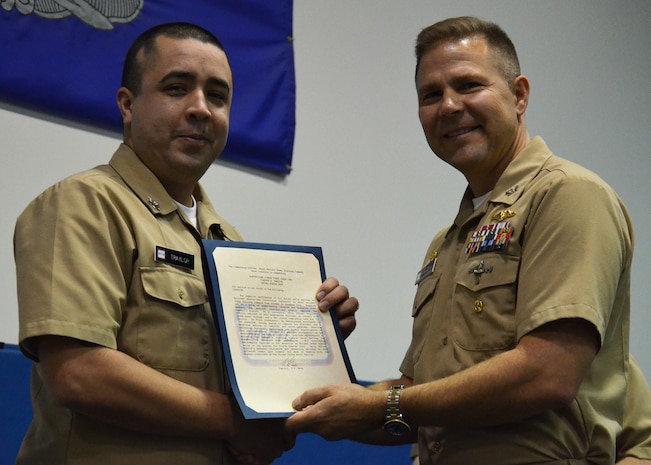 Capt. Jon “Jay” Fahs congratulates Petty Officer 1st Class Timothy Traylor, one of four Naval Nuclear Power Training Command’s Sailors of the Quarter, for the last quarter of calendar year 2012 Jan. 31, 2013, at NNPTC at Joint Base Charleston – Weapons Station.  Petty Officer 1st Class Ladunn Monday, Petty Officer 1st Class Jeremy Patin and Petty Officer 1st Class Anthony Pagliarini were also recognized by NNPTC leadership for their exemplary performance. (Courtesy photo)
