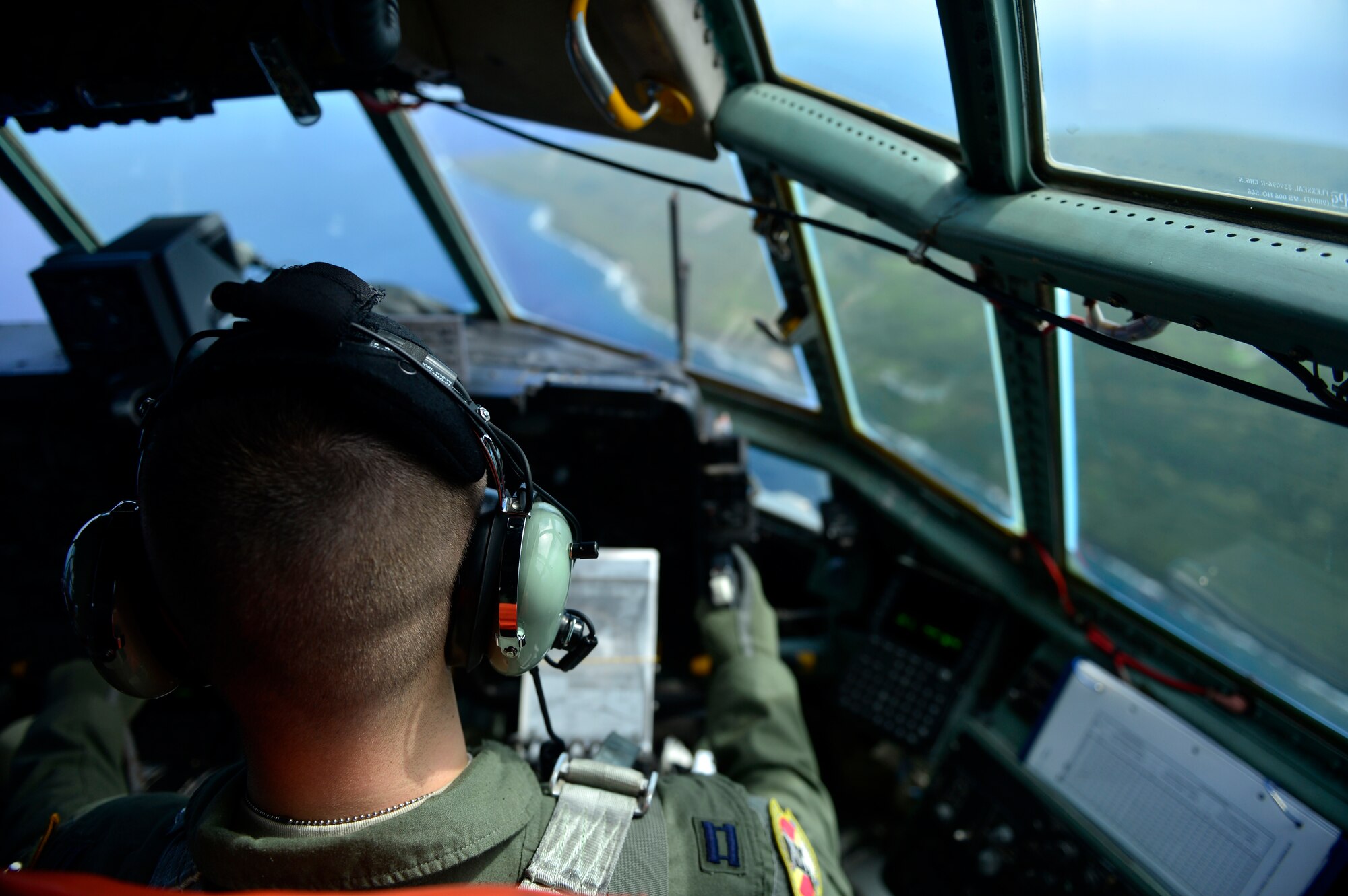 Tinian island is seen here from the flight deck of a C-130H flying a humanitarian aid and disaster relief training mission in support of Cope North 13, Feb. 6, 2013. Cope North is an annual air combat tactics, humanitarian assistance and disaster relief exercise designed to increase the readiness and interoperability of the U.S. Air Force, Japan Air Self-Defense Force and Royal Australian Air Force. (U.S. Air Force photo by Senior Airman Matthew Bruch/Released)