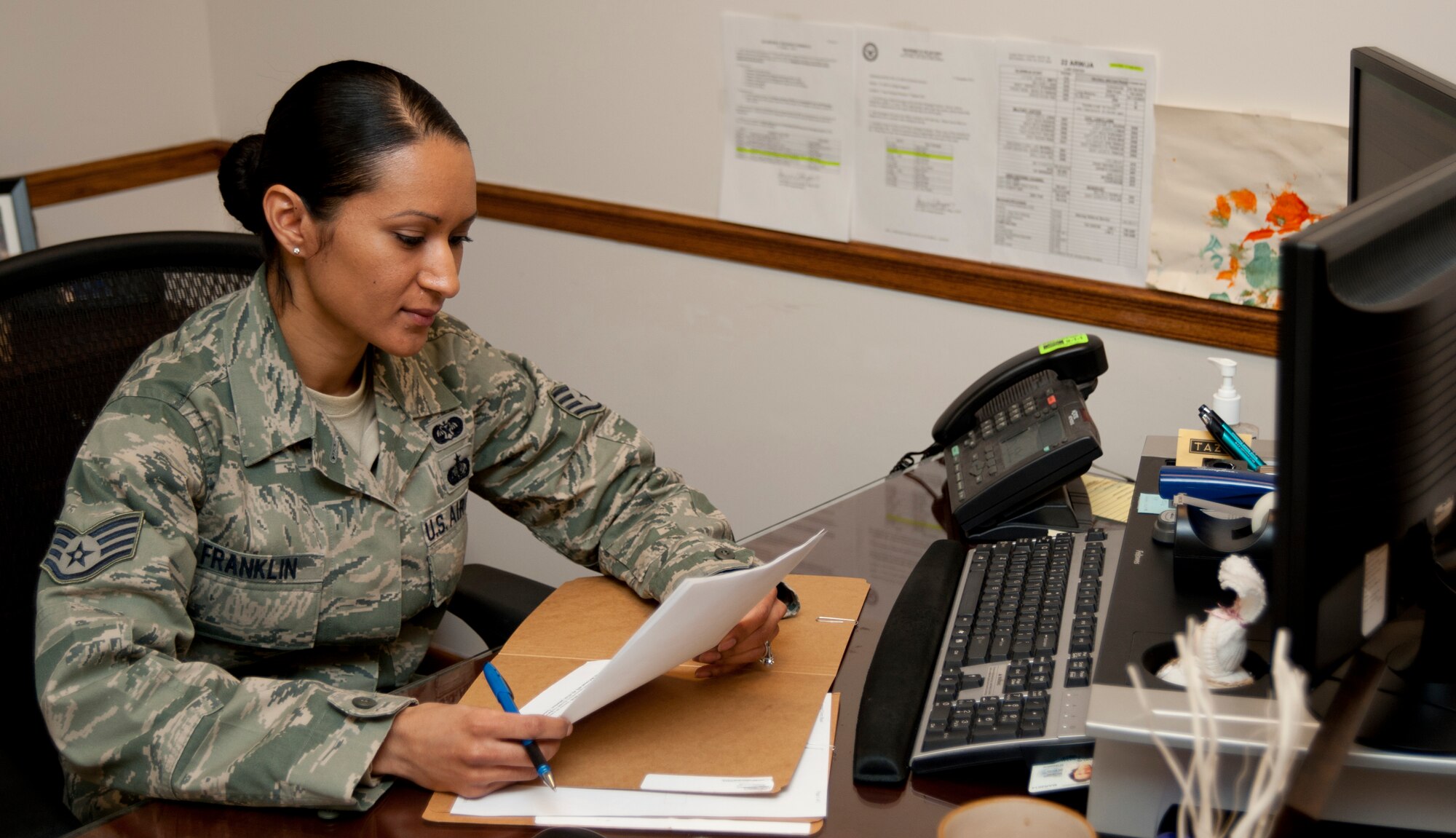 Staff Sgt. Kimberly Franklin, 22nd Air Refueling Wing Judge Advocate general law NCO in charge, reviews a commercial sponsorship agreement Feb. 6, 2013, McConnell Air Force Base, Kan. Franklin was selected as the spotlight performer for the week of Feb. 4 to 8, 2013, for fulfilling the 22nd ARW commander’s intents. (U.S. Air Force photo/Airman 1st Class Victor J. Caputo)