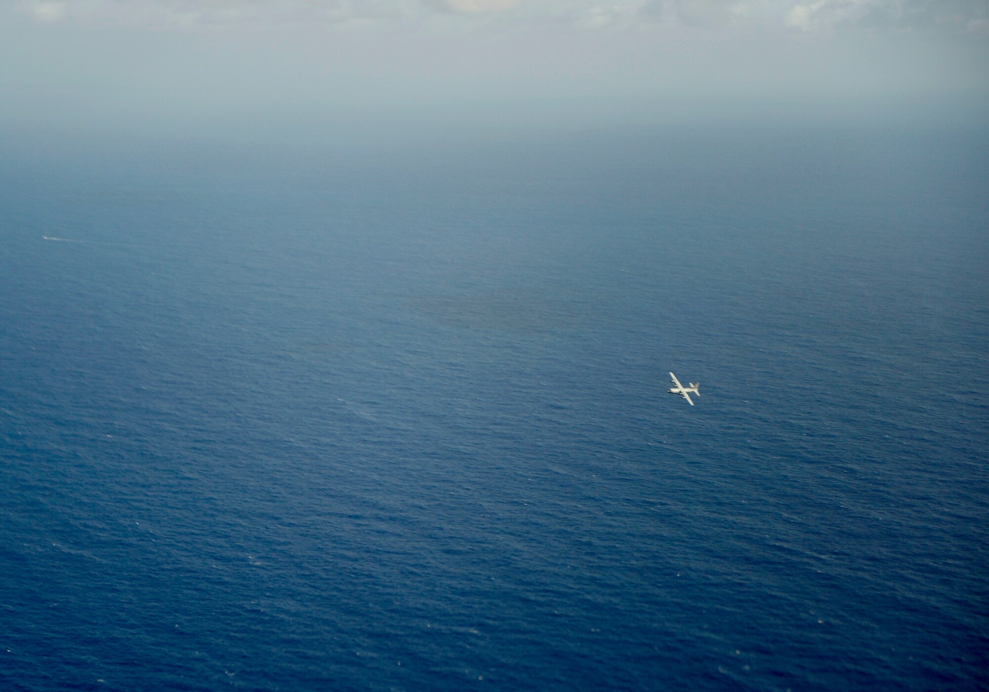 A U.S. Air Force C-130H assigned to 36th Airlift Squadron, Yokota Air Base Japan, flies in support of Cope North 13 near Anderson Air Force Base, Guam, Feb. 6, 2013. Cope North is an annual air combat tactics, humanitarian assistance and disaster relief exercise designed to increase the readiness and interoperability of the U.S. Air Force, Japan Air Self-Defense Force and Royal Australian Air Force. (U.S. Air Force photo by Senior Airman Matthew Bruch/Released)