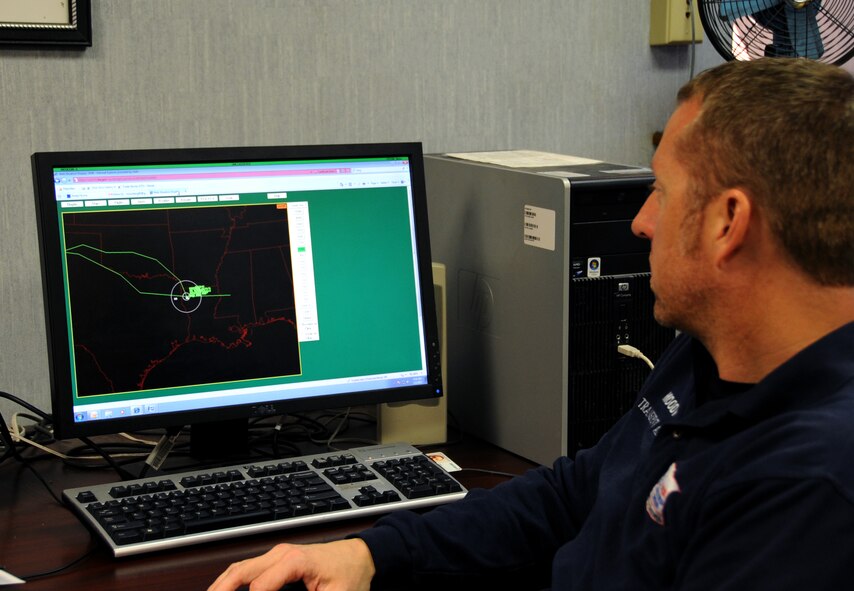 John Moody, 2nd Maintenance Squadron transient alert, watches a flight tracker on Barksdale Air Force Base, La., Feb. 6. The flight tracker informs the transient alert team where a certain aircraft is and how close it is to base. (U.S. Air Force photo/Airman 1st Class Benjamin Gonsier)