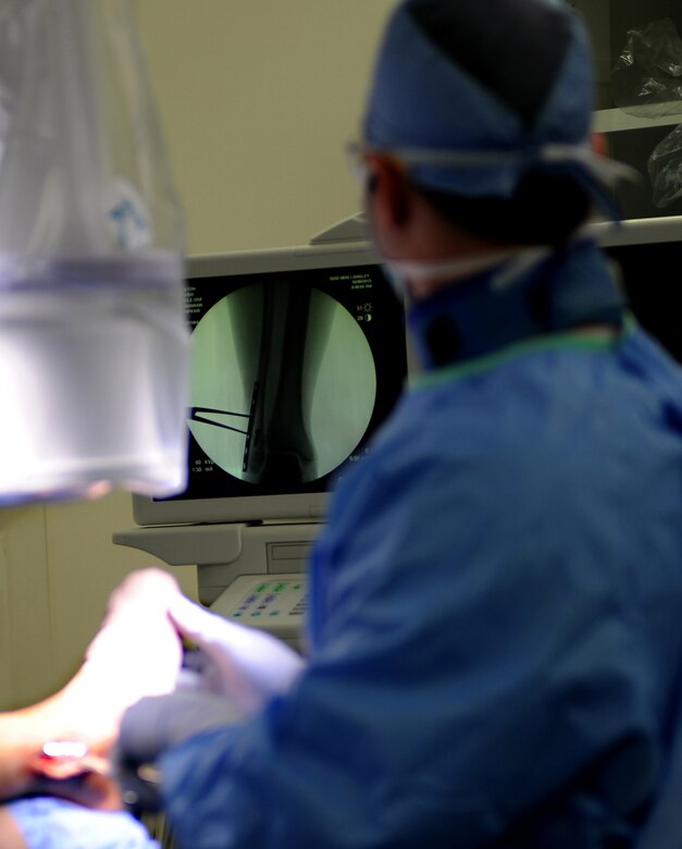 U.S. Air Force Maj. Michael Tompkins, M.D., 633rd Surgical Operations Squadron orthopedic surgeon, uses X-rays to verify the proper placement of a metal plate in a patient’s ankle during a procedure at Langley Air Force Base, Va., Feb. 5, 2013. Langley Hospital’s new Orthopedic Clinic will facilitate between 7,500 and 10,000 patients per year. (U.S. Air Force photo by Senior Airman Teresa Aber/Released)