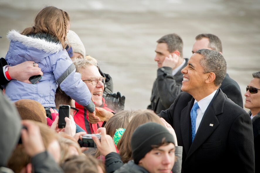 Invited guests greet President Barack Obama after his arrival at the 934th Airlift Wing, Minneapolis-St. Paul Air Reserve Station, Minn.  The President is in Minneapolis for a discussion about gun control at the Minneapolis Police Department Special Operations Center.  (U.S. Air Force Photo/Shannon McKay)
