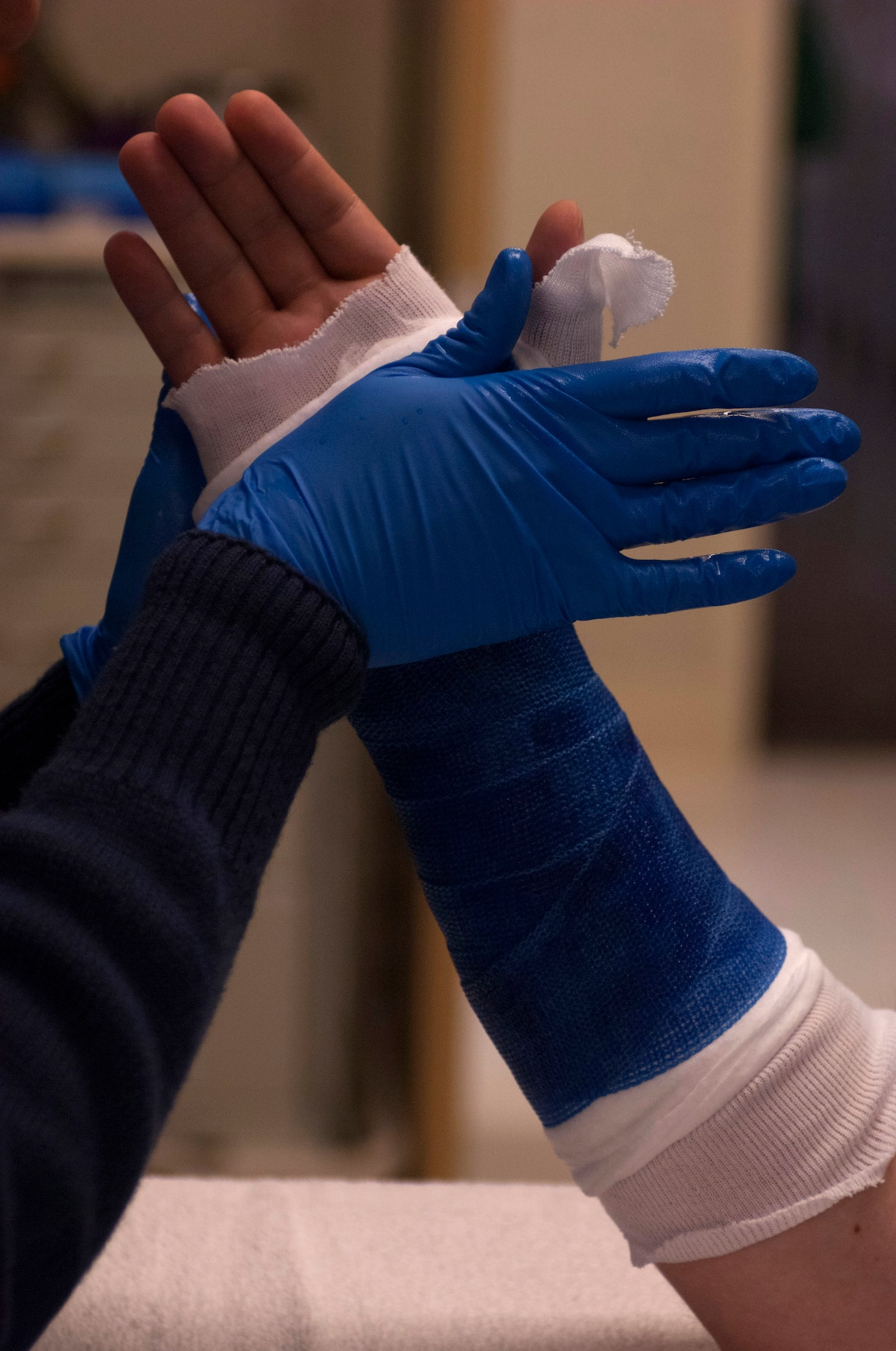 U.S. Air Force Staff Sgt. Diana Soare, 633rd Surgical Operations Squadron medical technician, shapes a forearm cast inside the new multi-service clinic at U.S. Air Force Hospital Langley at Langley Air Force Base, Va., Jan. 31, 2013. The multi-service health center not only provides an efficient space to treat patients, but also fosters a unique environment for medical providers to work closely with professionals in other specialties to ensure patients’ needs are met in an efficient, thorough manner (U.S. Air Force photo by Airman 1st Class R. Alex Durbin/Released)