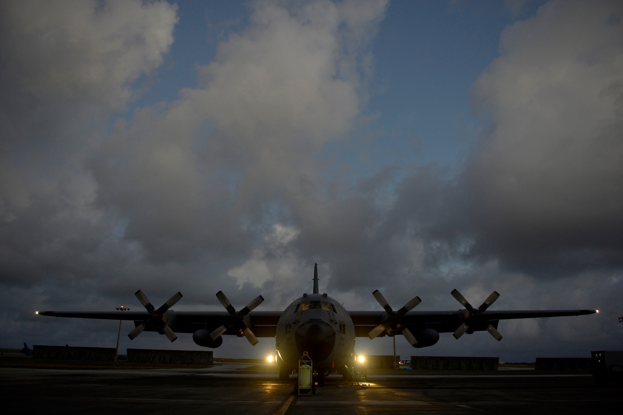 A U.S. Air Force C-130H sits on the ramp at Anderson Air Force Base, Guam before flying a humanitarian aid and disaster relief mission in support of Cope North 13, Feb. 6, 2013.  During the flight, the crew picked up passengers and cargo and delivered them to the islands of Saipan and Tinian. Cope North is an annual air combat tactics, humanitarian assistance and disaster relief exercise designed to increase the readiness and interoperability of the U.S. Air Force, Japan Air Self-Defense Force and Royal Australian Air Force. (U.S. Air Force photo by Senior Airman Matthew Bruch/Released)