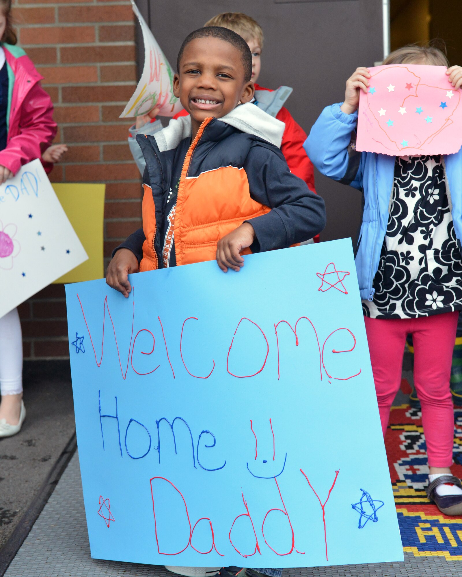 Jaylen Dunn, waits for his dad, Staff Sgt. Corey Dunn, 10th Airlift Squadron loadmaster, to return from a deployment, Feb. 5, 2012, at Joint Base Lewis-McChord, Wash. The 10th AS deployed for 60 days to Southwest Asia. (U.S. Air Force photo/Staff Sgt. Jason Truskowski)