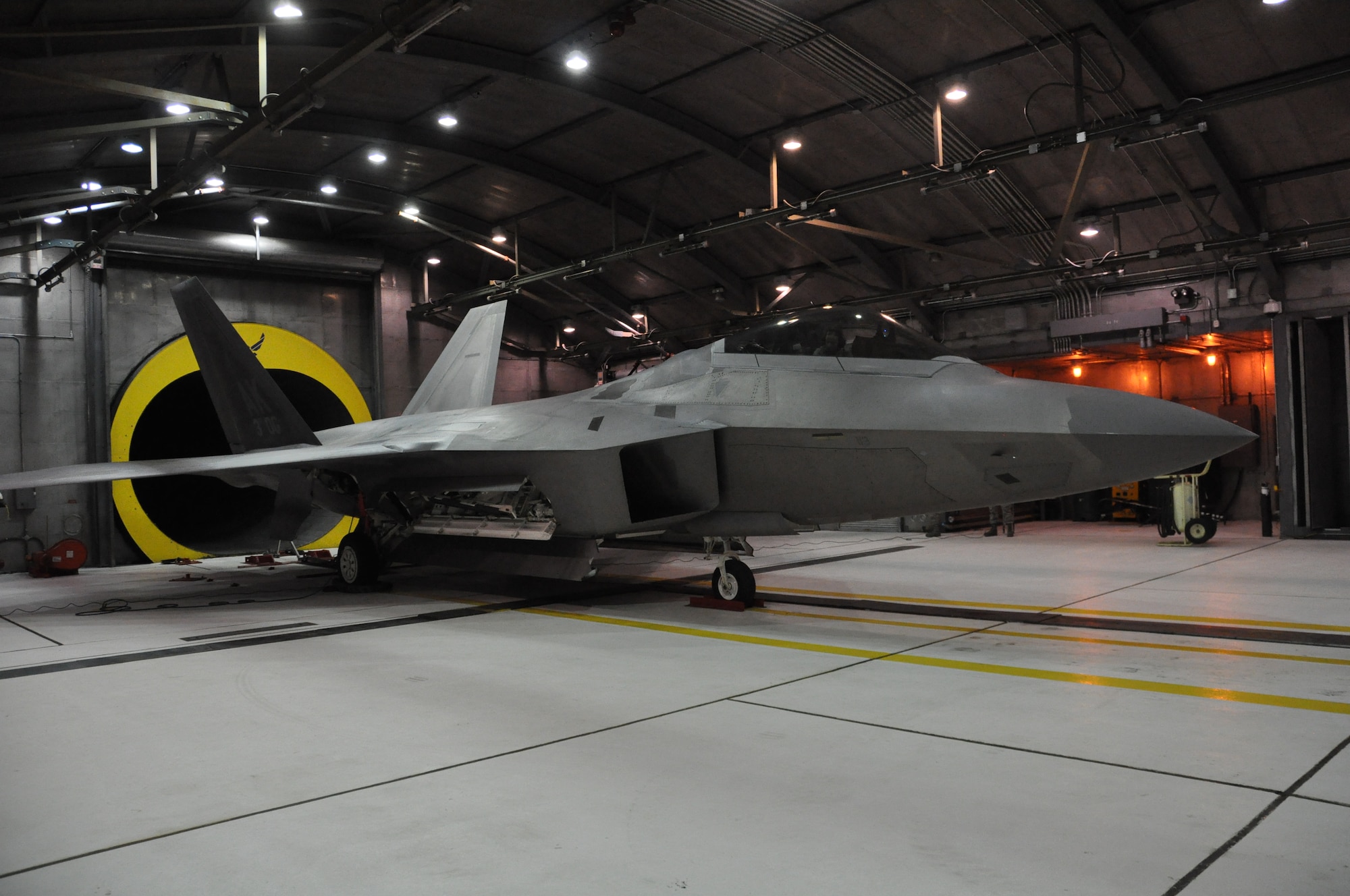Senior Airman Jennifer Dunham, 3rd Aircraft Maintenance Squadron F-22 crew chief, prepares to be evaluated on her first F-22 engine run. Dunham was one of three students that had attended a week long training course to become certified to perform safe engine runs on the F-22. Maintenance personnel routinely perform operational checks of all the aircraft systems, such as hydraulics or avionics, after performing maintenance on the aircraft. (U.S. Air Force Reserve Photo/Tech. Sgt. Dana Rosso)

