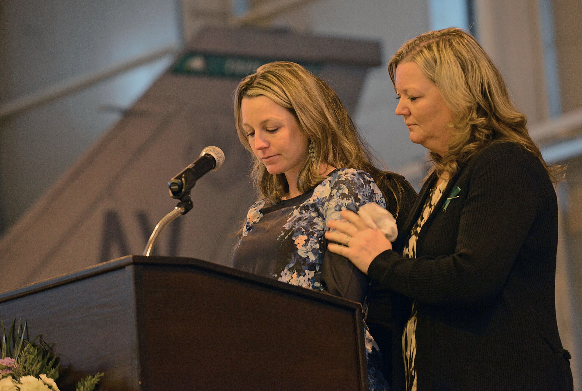 The wife and mother-in-law of U.S. Air Force Maj. Lucas Gruenther speaks during a memorial service on Aviano Air Base, Italy, Feb. 6, 2013. Approximately 1,000 people attended the memorial service for Gruenther, who lost his life when his aircraft went down during a training mission on Jan. 28. (U.S. Air Force photo/Airman 1st Class Matthew Lotz)