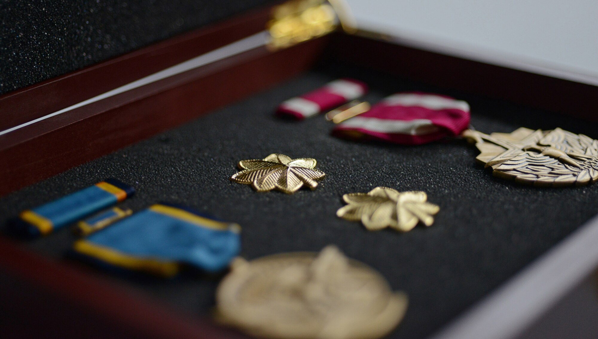 The officer rank of major and two medals were given to U.S. Air Force Maj. Lucas Gruenther's wife during a memorial service on Aviano Air Base, Italy, Feb. 6, 2013. Approximately 1,000 people attended the memorial service for Gruenther, who lost his life when his aircraft went down during a training mission on Jan. 28. (U.S. Air Force photo/Airman 1st Class Matthew Lotz)