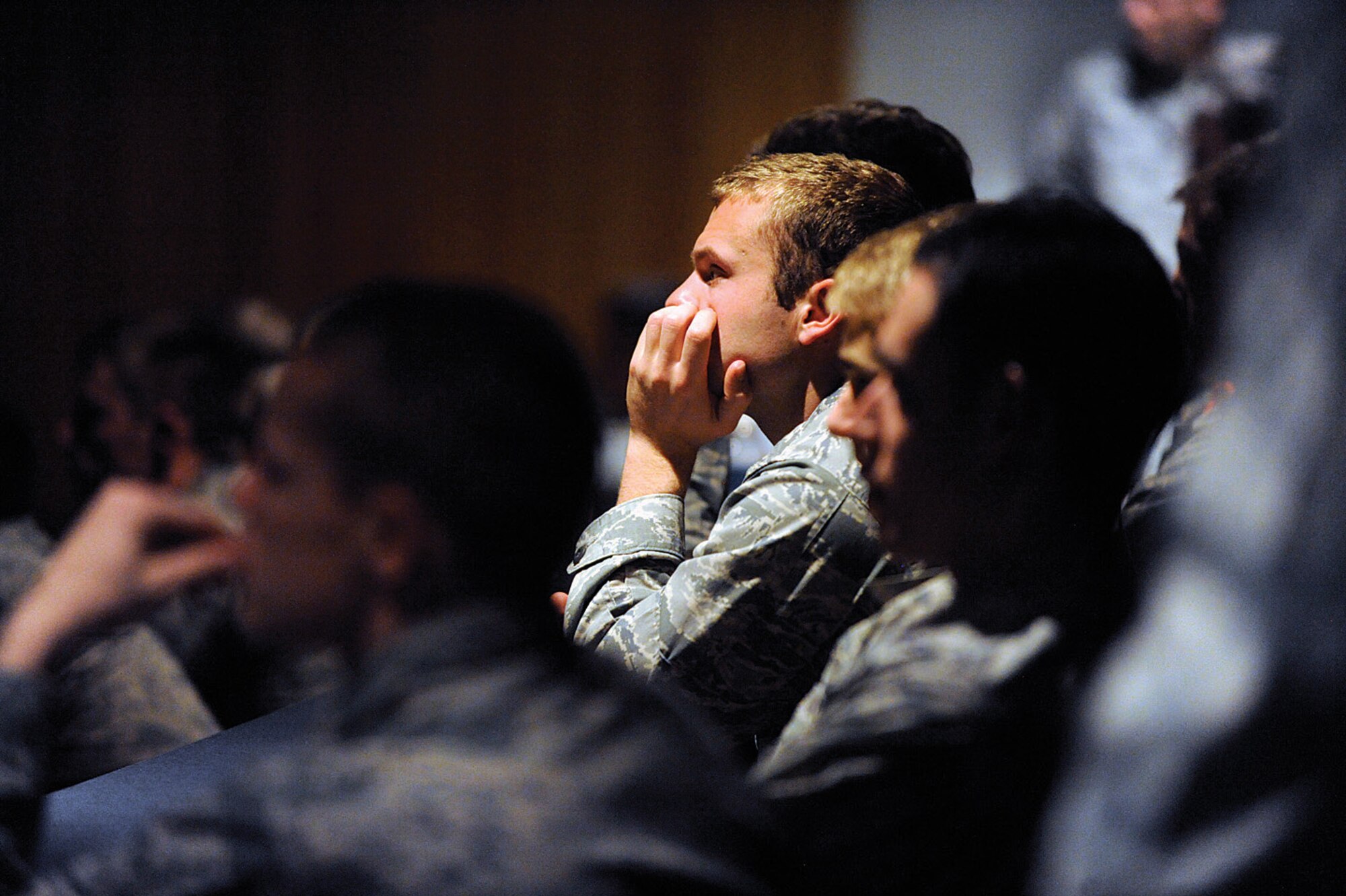 Cadets watch a 17-minute preview of "Inside Combat Rescue," a National Geographic Channel TV series featuring Air Force pararescuemen deployed to Kandahar Airfield, Afghanistan, during a special presentation at the Air Force Academy Feb. 1, 2013. One of the officers featured in the series, HH-60 Pave Hawk pilot Maj. Devin Ryan, is a 2001 Academy graduate. (U.S. Air Force photo/Carol Lawrence)