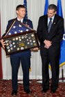 HANSCOM AIR FORCE BASE, Mass. – Maj. Gen. Craig S. Olson, C3I and Networks program executive officer, presents Ron Mason, special assistant to the PEO for C3I&N, a shadow box during his retirement ceremony at the Minuteman Commons Jan. 31. Mason, who served in several senior leader roles at Hanscom, retired after 32 years of federal service. (U.S. Air Force photo by Linda LaBonte Britt