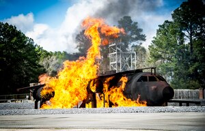 Flames engulf a static training aircraft at the beginning of a training scenario for 628th Civil Engineer Squadron firefighters Jan. 30, 2013, at Joint Base Charleston - Air Base, S.C. The static training aircraft allows Team Charleston 628th CES fire fighters the opportunity to practice their fire response abilities in case of an actual emergency. (U.S. Air Force photo/Staff Sgt. Rasheen Douglas)