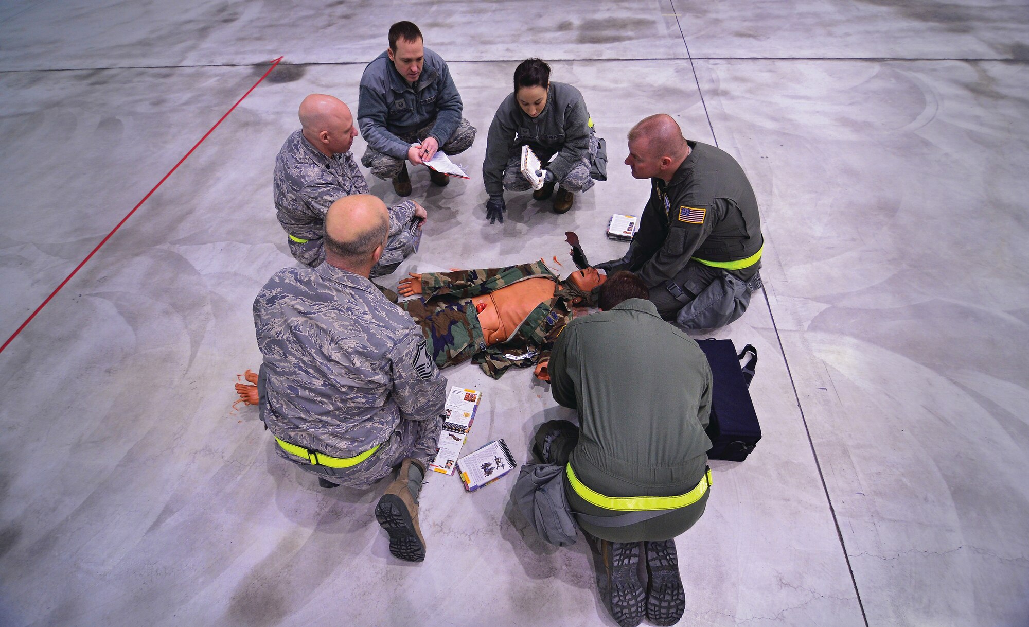 WRIGHT-PATTERSON AIR FORCE BASE, Ohio - The 445th Aeromedical Evacuation Squadron team assesses the status of a simulated wounded Airman during the self-aid and buddy care portion of the 445th Rodeo held Jan. 24. (U.S. Air Force photo/Staff Sgt. Mikhail Berlin)